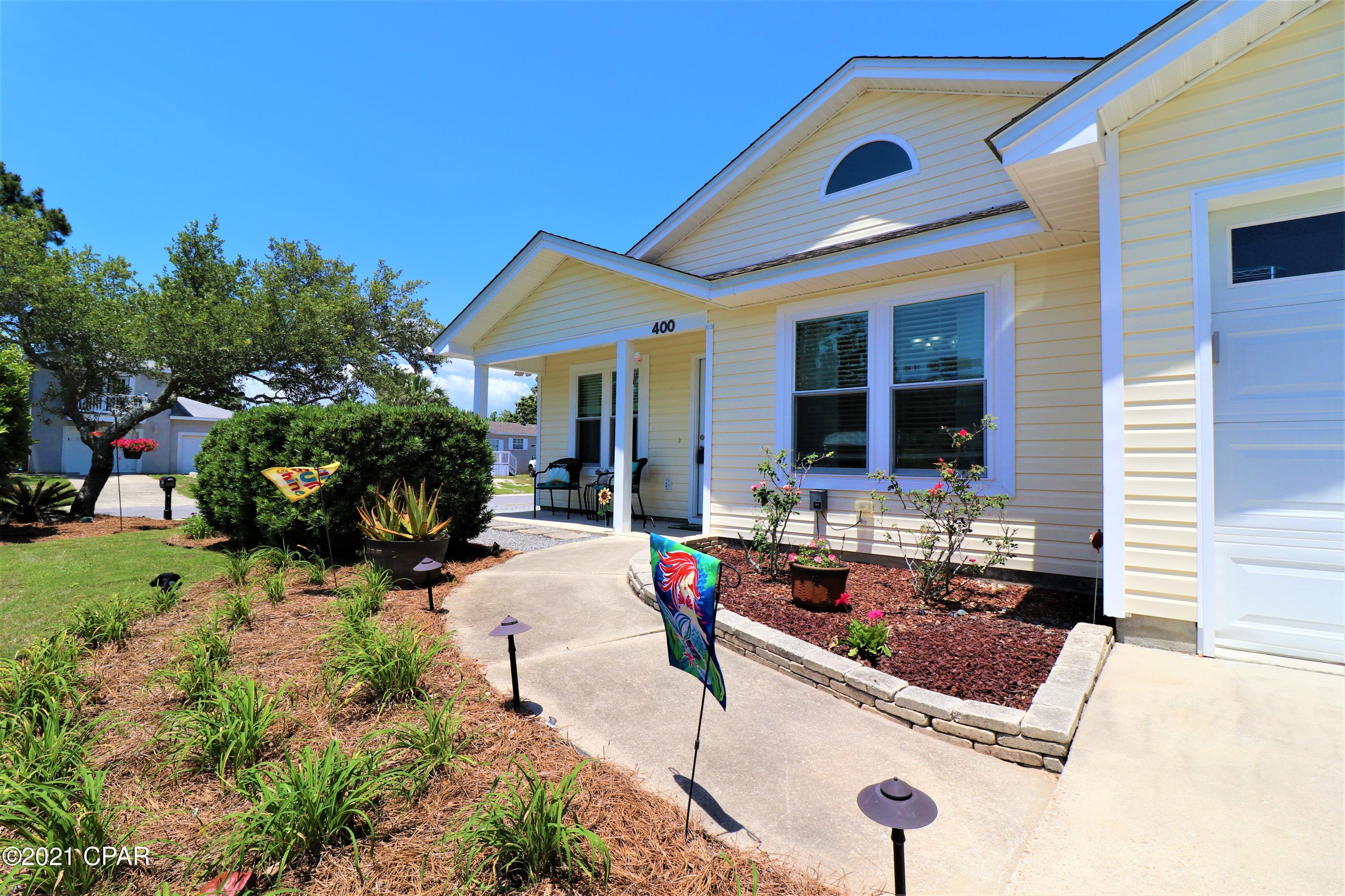 Super Cute 3 bedroom 2 bath home on a large corner lot on Panama City Beach, but in the County!  This home is conveniently located to all things Bay County and just minutes to the Navy Base and the Beautiful White Sands of Panama City Beach!  Large corner lot, fenced, 12 x 10 storage building, double gate on the side so you can easily pull your Boat, Camper or whatever your choice of toys are to be parked! This awesome home features but not limited to: Screened Porch, pavers and firepit, Double Hung Impact Windows, New roof in May 2019, newly painted interior, new LVP in living areas, HVAC 2020, Microwave range hood & water heater in 2017, dishwasher & disposal in 2019 and so much more, you just have to see it! Call your favorite Realtor today to schedule your private showing. Thank you! All measurements and information should be verified if important.  Thank you for considering this wonderful home!