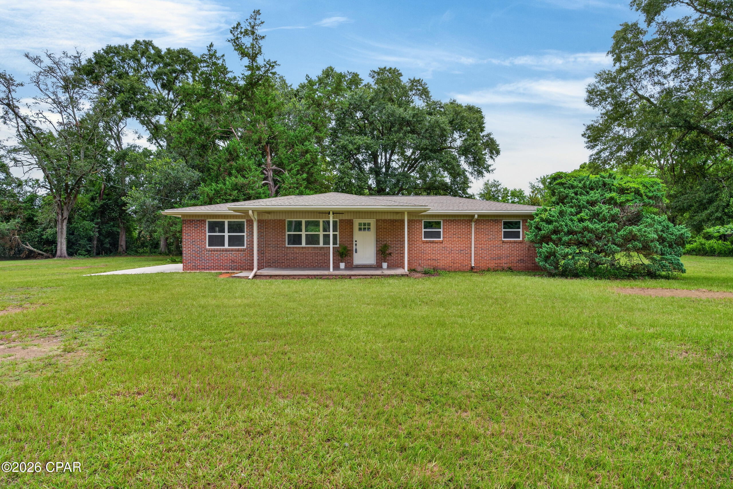 Don't let the age of this home fool you--this beautifully renovated property is move-in ready and filled with modern updates! Situated on over an acre within the Chipley city limits, this 3-bedroom, 2-bath home offers a spacious and functional layout, along with a versatile bonus room that could serve as a fourth bedroom, home office, playroom, or additional den. Major improvements include a new roof, HVAC system, and updated electrical. The kitchen features solid-surface countertops, stainless steel appliances, and an open design that flows seamlessly into the living area, making it ideal for everyday living and entertaining. With generous outdoor space and the convenience of an in-town location, this updated home is a rare find!
