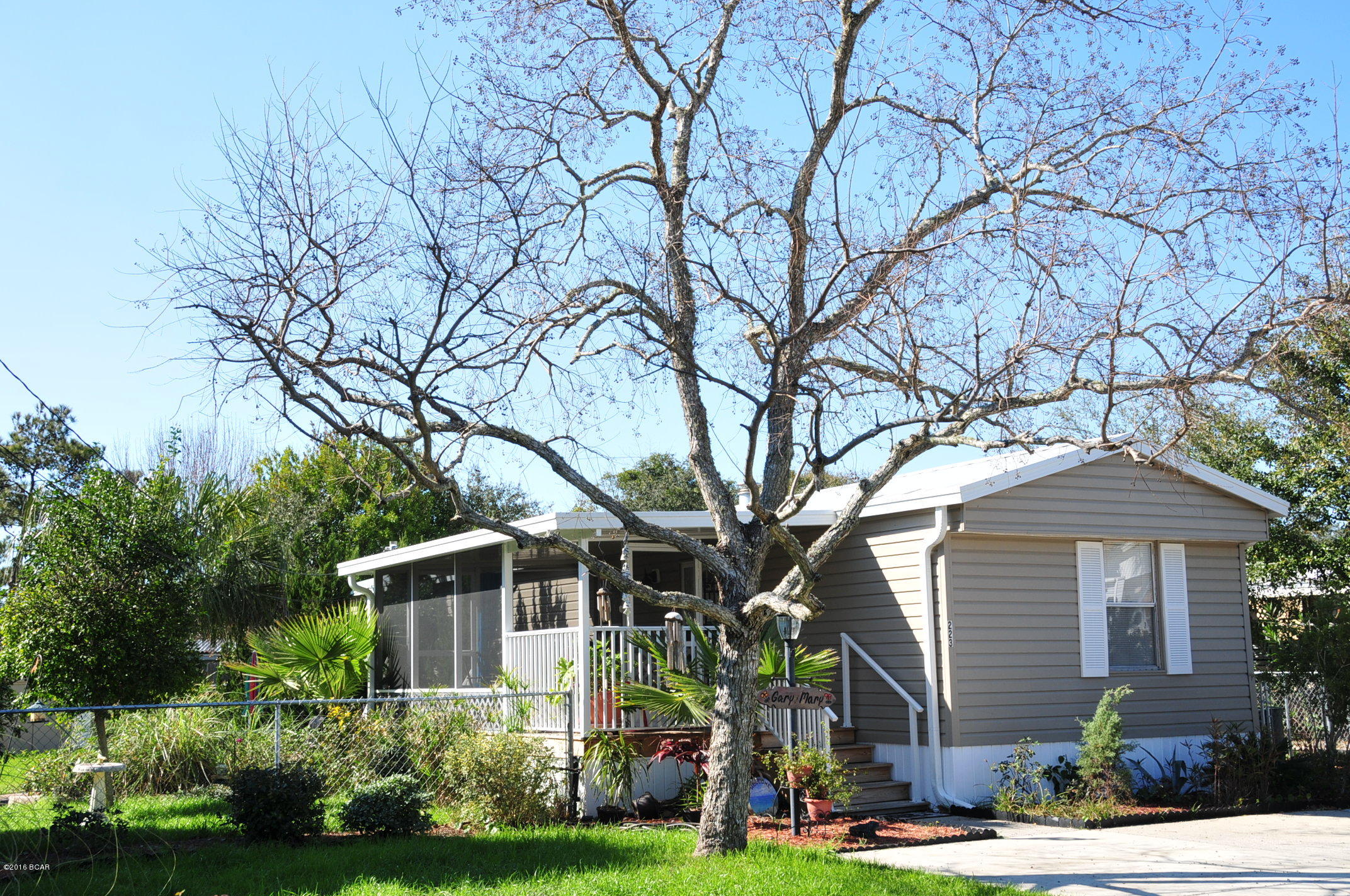 Nice home only one and a half blocks to the beach! Split floor plan perfect for sharing. This affordable home is close to Pier Park and ''The World's Most Beautiful Beaches''. Enjoy the screened in front porch and the quiet setting of this nicely landscaped yard complete with fruit trees, squirrels and birds. This home has been very well maintained and has a metal roof only a year old. Comes with storage shed, fenced in lawn, large drive and most furnishings.