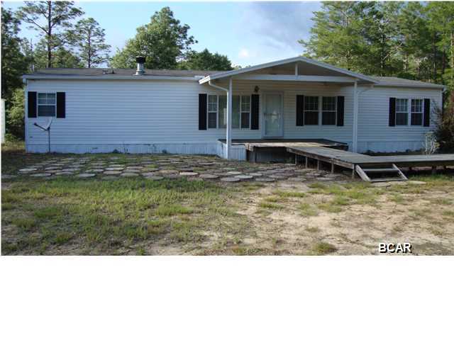 Want to own a home in the country? Room for all your pets and animals on this 2+ acre site complete with an immaculate double-wide manufactured home. with two outbuildings. The home is a 3 bedroom, 2 bath home with large living and dining areas, eat-in kitchen, and a separate laundry room. One of the outbuildings has a carport and workshop. Just a short distance to the town of Vernon and about a 30 minute drive to the Beach.