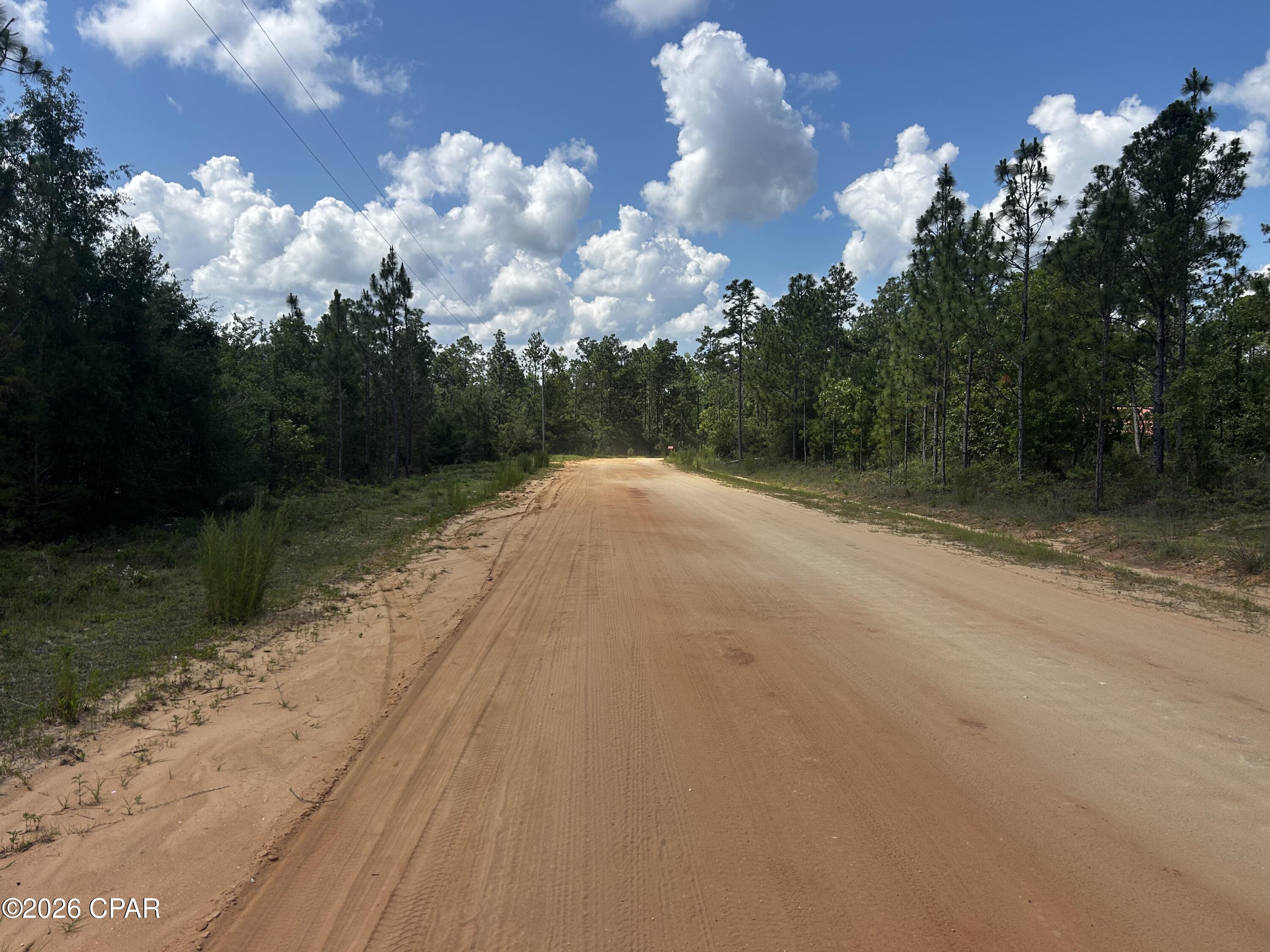 Beautiful residential corner lot located in the Compass Lake in the Hills Subdivision. HOA is voluntary but gives you access to a lot of amenities if you do choose to pay for it which includes access to 2 gorgeous lakes, cabin rentals, pavilion use, swimming pool, golf, boat launch ramp & some RV facilities. Located a short drive from Panama City Beach, Tyndall Air Force Base, & Panama International Airport. If you enjoy peace and quite, this is the opportunity for you to build your dream house