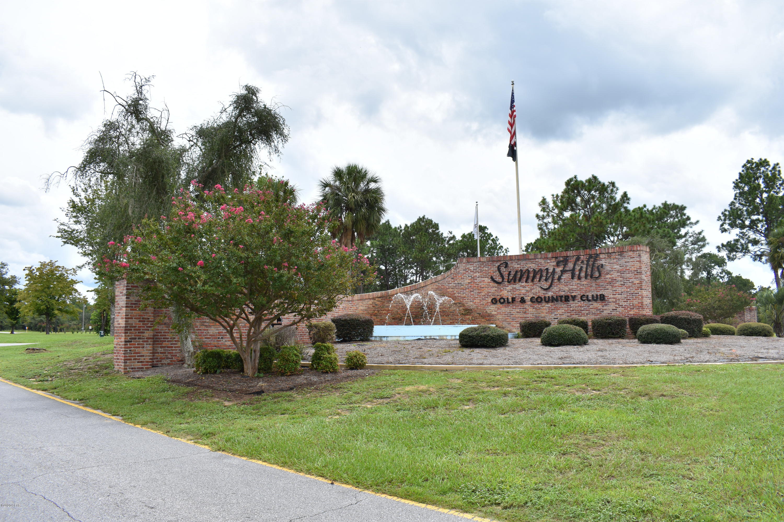 This spacious paved lot located in Sunny Hills backs up to greenbelt property.   It is located near White Double Pond which is a great place to fish & swim.  If you are a golfer, there is an 18 hole golf course in this community.  Located within minutes of the airport and the World's Most Beautiful Beaches, this would be an excellent choice for a future home or investment property.
