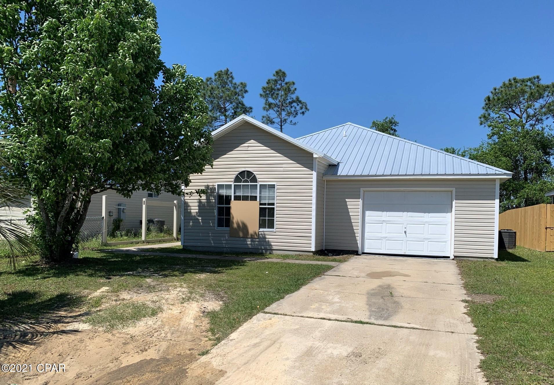Currently under contract, seller accepting backup offers. Own your own home with a payment less than what you would pay to rent. This 3 bedroom 2 bath home is located in Sweetwater Village, a community 10 minutes north of Panama City with access to a private lake, playground and pavilion. The home has cathedral ceilings in the Great Room and the Master Bedroom. The eat-in kitchen is spacious with lots of cabinets, matching appliances, a pantry, and it opens to the backyard. The home has new vinyl plank floors, and entire interior of the home was just painted. Newer metal roof, HVAC 2017, water heater 2013. This neighborhood has quick access to HWY 231 and is located 25 minutes from Tyndall Air Force Base. All info is approx and must be verified by Buyers if important.