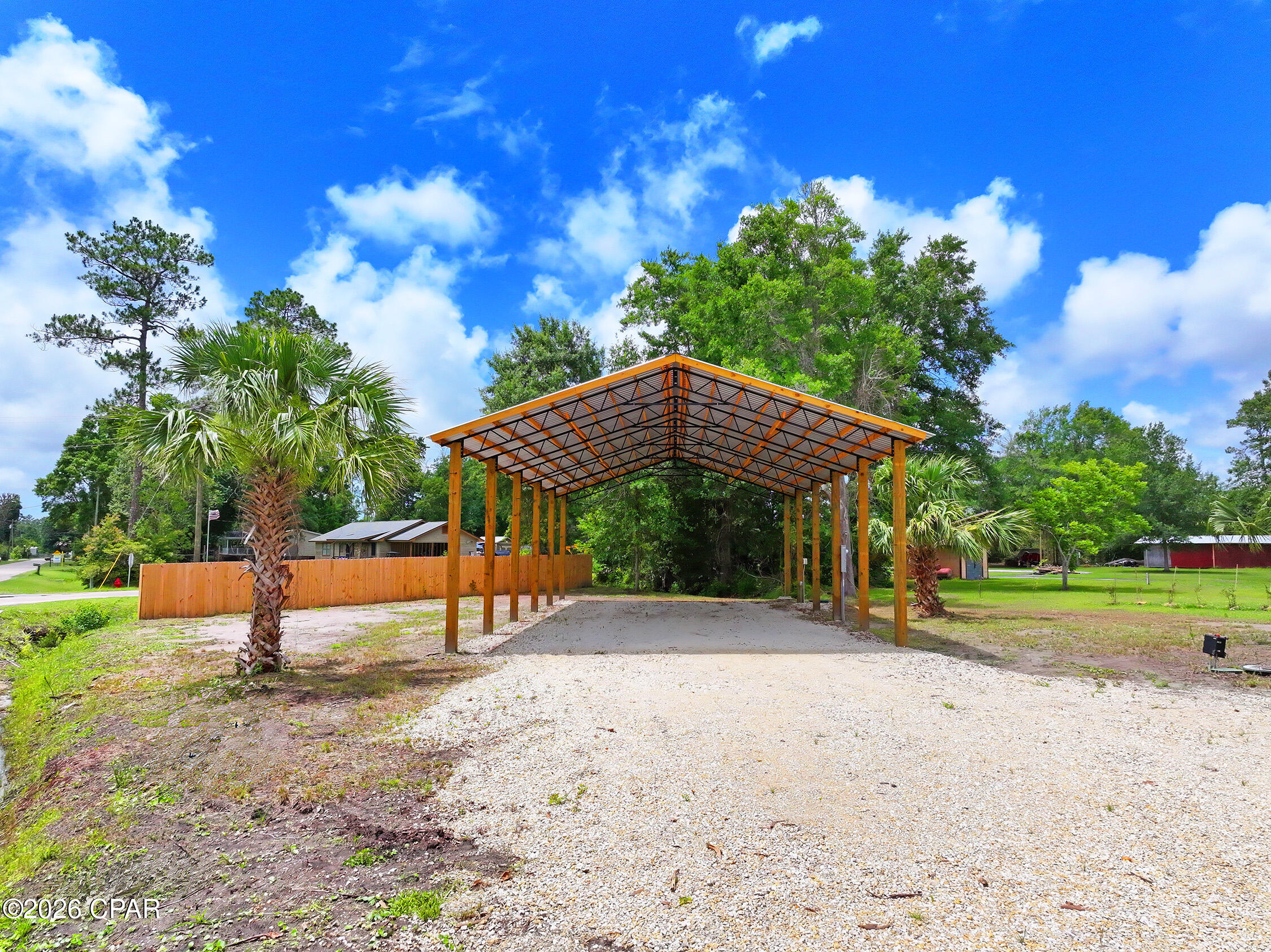 Own Your Piece of Florida's Forgotten Coast. Purchase an RV Approved Lot totaling .36 acres here in beautiful Gulf County, Florida. Located just 7 miles from Port Saint Joe and 600 feet from the White City Public Boat Ramp. This improved lot is ideal for Full-time RV living, vacation getaways, and rental income. Located in an X Flood Zone (no flood insurance required should you ever choose to build), this lot has been meticulously finished to include a 60x30 Pole Barn featuring 8x8 poles and 14 foot eaves, gravel pad and driveway, underground 100 amp utilities featuring both 50 amp and 30 amp hookups, county sewer, and city water. An added bonus is the lot features a 35x25 block building with a brand new metal roof, perfect for securely storing all your toys. Vacation on it, rent it, or turn it into the ultimate RV home base. Located within 600 feet of the White City Public Boat Ramp, you can launch your boat onto the Intracoastal Waterway within minutes and enjoy world-class fishing and easy access to the Gulf. Don't miss this opportunity to purchase this RV Approved lot. *Neighboring parcel is also available as a combined package, see MLS #790773 for details.*