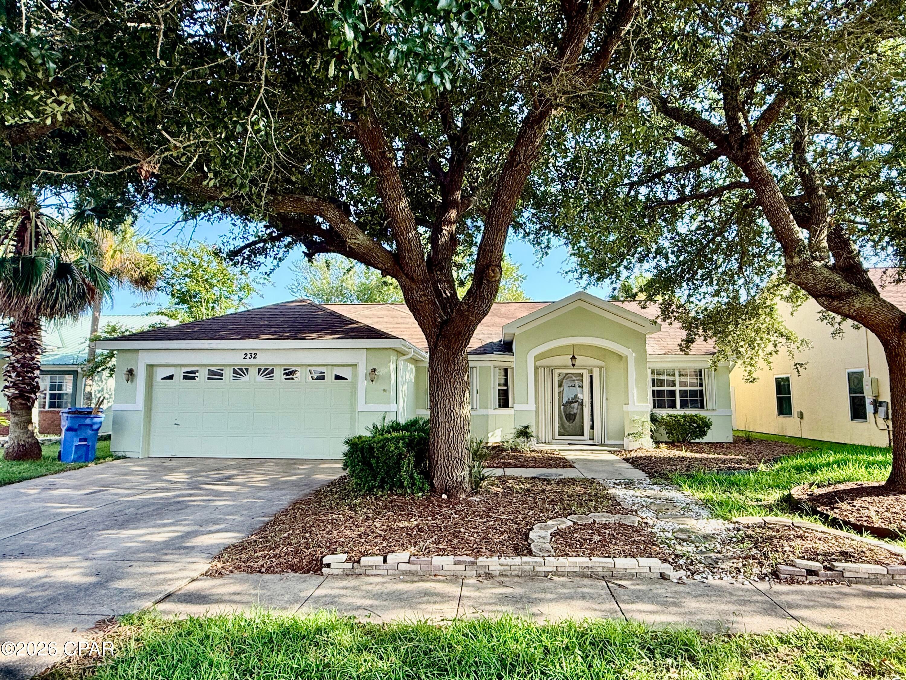 3BR/2BA home in Summerwood with 1,594 sq ft. and a Community POOL.  Single-story layout featuring tile and LVP flooring, central HVAC, stucco exterior, and a spacious living area. Fenced yard, Screen and covered huge patio, large workshop/storage building, and 2 car garage. Located just minutes from Back Beach Rd, shopping, dining, Pier Park, and the beach. Pets allowed.