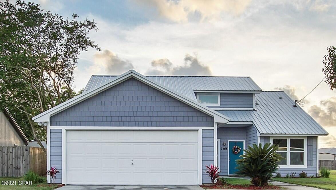 CURRENTLY UNDER CONTRACT, SELLER ACCEPTING BACKUP OFFERS. Fantastic Lynn Haven home is now ready for its next owner. 3 bedroom, 2 bath, dining room, 2 car garage, big covered back porch and large fenced in backyard - this home has it all !! Charming metal roof makes this home super special.  ZERO CARPET for low maintenance living & vaulted ceilings in the family room that brings in tons of natural light into the living area. The backyard is  fully fenced in with a  double gate. Oversized 2 car garage with a sealed floor is a bonus!