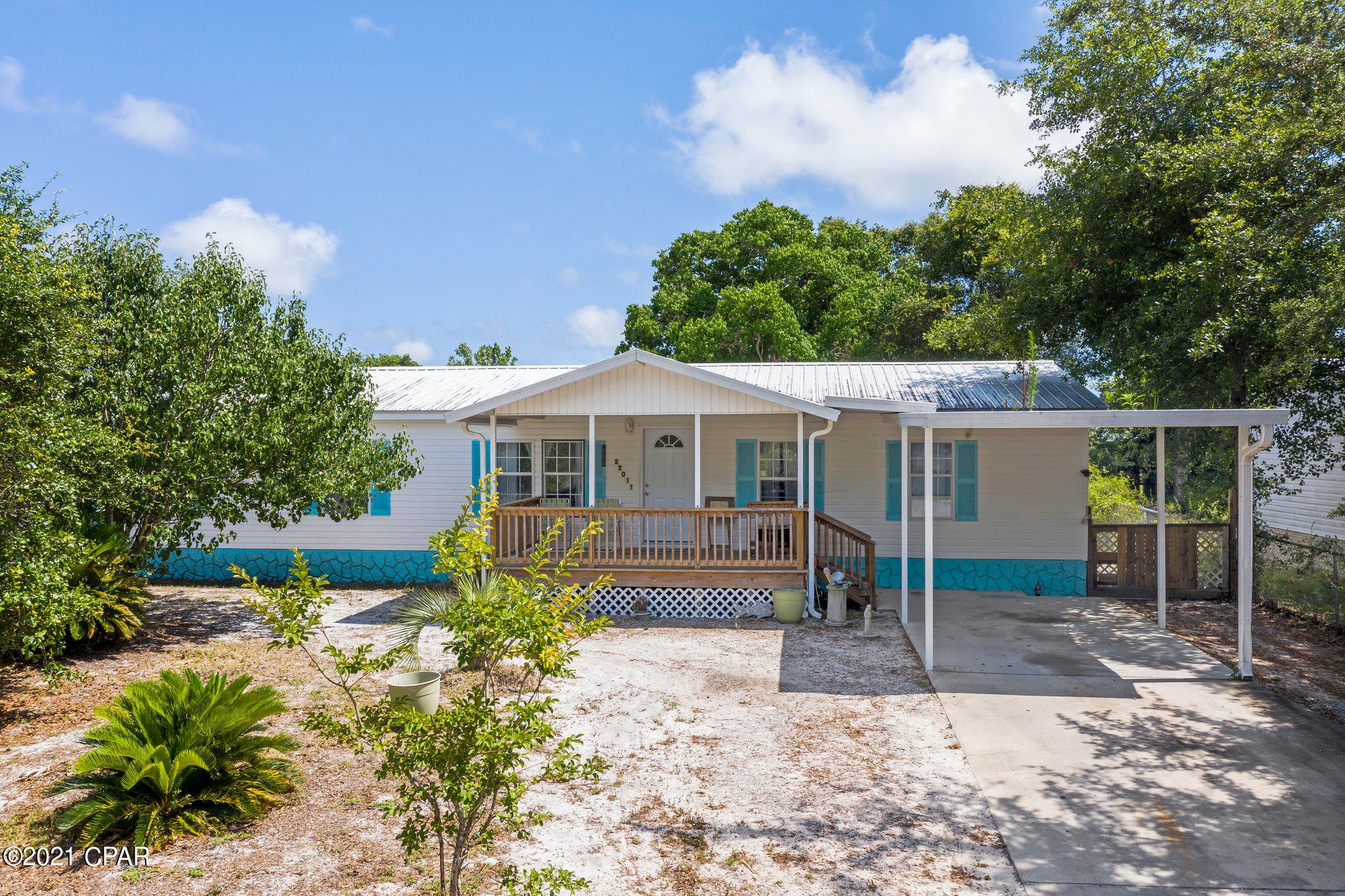 CURRENTLY UNDER CONTRACT, SELLER ACCEPTING BACKUP OFFERS. Location, location, location is an accurate statement for this immaculate 3 bedroom 2 1/2 bath home, located in Inlet Beach Heights, & on the desired West end of Panama City Beach. Lots of new construction coming up! Enjoy water views of Lake Powell from the front porch, master bedroom & dining area in a peaceful and serene setting. The home features a 2015 metal roof, new luxury vinyl plank flooring, new butcher block island & the A/C is only a few years old. Large (fenced in) 82x150 lot, provides plenty of privacy. Property is  being sold furnished. Located near Lake Powell boat ramp and Camp Helen. Close to Scenic 30A, Pier Park, Frank Brown Park and a short golf cart or bike ride to the emerald beaches. Age and sq. ft. approx.