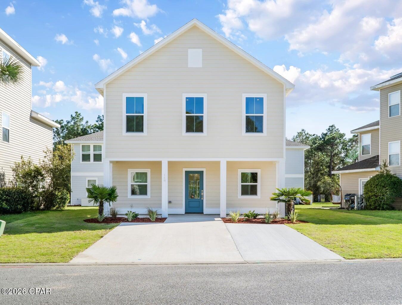 BACK ON MARKET AT NO FAULT OF THE SELLER! With a recent appraised value of $422,000, this is your opportunity to walk into immediate equity while enjoying all the advantages that come with new construction. Built with durable steel framing and impact resistant windows, this move-in ready home offers quality construction designed for Florida living. These weather resistant features provide added durability while contributing to lower homeowners insurance costs, giving you added confidence in your investment. A welcoming covered front porch and freshly landscaped yard lead into an open-concept main level with upgraded design throughout. A convenient half bath sits just off the entry, while a custom accent wall anchors the living space. The kitchen features a functional island, stainless steel appliances, granite countertops, and soft-close cabinetry. Upstairs, you'll find three bedrooms, two full bathrooms, and a dedicated laundry room. The primary suite features a tiled shower and multiple closet options. LVP flooring flows throughout, complemented by elevated finishes. This is your opportunity to own a truly fairytale home in Enchanted Estates!

Outside, the fully landscaped yard with irrigation creates a true turn-key experience ideal for a primary residence, vacation getaway, or investment property. Enchanted Estates offers desirable amenities including a dog park, nature trails, and a sparkling community pool, all just minutes from the beach.