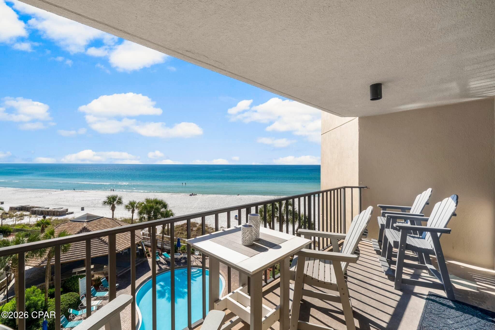2BR/2BA Gulf-front remodeled condo in Summerhouse, Panama City Beach. Furnished, dual balcony access, 1,015 sq ft, STR allowed

Unit 512C at Summerhouse is a fully furnished, thoughtfully updated 2-bedroom, 2-bath Gulf-front condo offering 1,015 square feet and unobstructed views of the Gulf, beach, and pool deck. Positioned on the fifth floor, the condo combines an established vacation-rental setup with the flexibility to serve as a coastal getaway or full-time residence. Short-term rentals are allowed.

The Gulf view becomes the focal point as soon as you enter. The living area opens to a covered private balcony through full-height sliding glass doors, while the primary bedroom has its own balcony access and direct water views. The connected living, dining, and kitchen spaces create an easy flow for everyday use, entertaining, and guest stays.

Inside, crown molding, updated lighting, vinyl plank flooring, coordinated coastal furnishings, and a clean, cohesive palette give the condo a polished finish. The kitchen features granite countertops, stainless steel appliances, bar seating, distinctive cabinetry, and a new dishwasher. Both bathrooms also have granite countertops, creating consistency throughout the interior.

The spacious primary suite includes Gulf views, balcony access, a walk-in closet, and an en-suite bath. The guest bedroom is furnished with two full beds and has convenient access to the second bathroom, providing a practical layout for owners and rental guests.

Recent improvements include a new water heater and dishwasher, with documentation available. The condo is being sold fully furnished, offering a turnkey setup with furnishings, appliances, and essential features already in place. There are no current special assessments.

The covered balcony provides room for dining and relaxing while overlooking the emerald Gulf, white-sand beach, pools, and tropical landscaping. Summerhouse amenities include direct beach access, two Gulf-front pools, a hot tub, kiddie pool, tennis and pickleball courts, a game room with billiards and arcade games, grilling areas, elevators, gathering spaces, and on-site security.

The monthly HOA fee is $1,264.69 and includes exterior insurance, management, cable, internet, water, sewer, trash, grounds maintenance, pest control, security, and access to community amenities. Located on Thomas Drive, the Summerhouse provides convenient access to St. Andrews State Park, Shell Island excursions, fishing, dining, shopping, and the recreational attractions of Panama City Beach.

Unit 512C stands apart through its fifth-floor Gulf-front position, views from the living area and primary suite, dual balcony access, cohesive updates, documented improvements, furnished condition, and rental-ready setup. Save Unit 512C and contact your agent for active-date details, showing availability, and the opportunity to experience this furnished Gulf-front condo in person.
