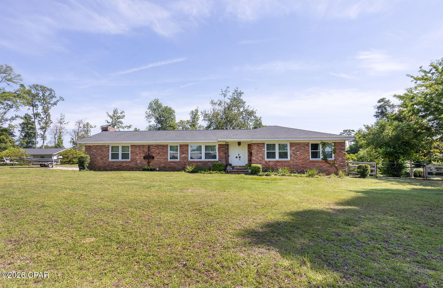 Welcome to this beautifully maintained 3 bedroom, 2 bath brick home situated on approximately 4 peaceful acres. Offering the perfect blend of privacy, convenience, and modern updates, this property is ideal for those seeking space while staying close to town. 
This move-in-ready home features a large family room with a fireplace, numerous recent upgrades including new windows, new water heater, new air conditioning,  and updated bathrooms giving buyers peace of mind for years to come. The roof was also replaced in 2018. Inside, you'll find a comfortable and inviting layout with spacious living areas and abundant natural light.
Outside, the property truly shines with approximately 4 acres ( 2 parcels) of beautiful land with a large fenced in area, patio, and an outbuilding. It offering endless possibilities for recreation, gardening, or simply enjoying the outdoors. A detached garage/workshop adds incredible versatility and includes electrical service and plumbing already in place for a future bathroom setup. This is the perfect space for hobbies, storage, a home business, or additional workspace.
Conveniently located near local schools, the Sports Park, Chipola River and Florida Caverns State Park. This home combines country-style living with easy access to everything Marianna has to offer.
Don't miss this rare opportunity to own a beautifully updated home with acreage in one of the area's most desirable locations! Motivated seller, bring an offer!