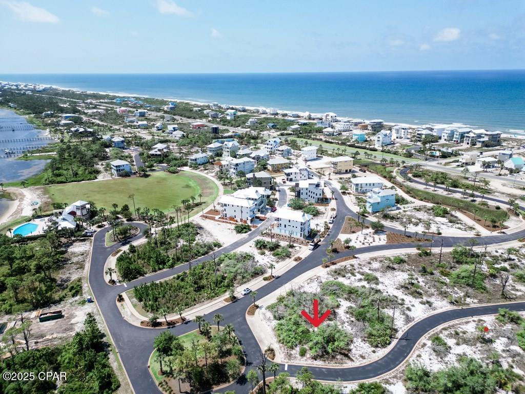 Unique lot located in a serene and upscale gated community? Lot 69 in OVATION at Cape San Blas, FL is a larger lot offering an opportunity for your new home site, with features that set it apart from the rest. Situated in a desired upscale gated community, lot 69 at OVATION boasts preserved land in front and on one side, providing an extra layer of privacy for homeowners. Spanning a generous .25 acre, this lot is larger than most in the area, offering ample space for your dream home. The layout of lot 69 is truly special, with the street curving around the lot on three sides, enhancing its charm and appeal. OVATION at Cape San Blas is a prestigious community that offers a wealth of amenities for residents to enjoy. On the Bay Side, residents have access to a Bay Clubhouse featuring an infinity pool, fitness room, tennis courts, greens area, fishing opportunities, and a dock on the bay. On the Gulf side, a community pool and beach access await, providing the perfect setting for relaxation and recreation. Nature enthusiasts will appreciate the proximity to St. Joseph State Park, where beach access, hiking trails, and stunning natural beauty abound. Additionally, the area offers a variety of dining options, ensuring that residents have everything they need right at their fingertips. For those who enjoy outdoor activities, Cape San Blas Road features a bike and jogging trail that stretches for several miles, offering a scenic route for exercise and exploration. Don't miss out on the opportunity to secure lot 69 at OVATION, Cape San Blas FL, and start building the home of your dreams in this coveted community. Experience the best of coastal living with unparalleled amenities and natural beauty right at your doorstep.