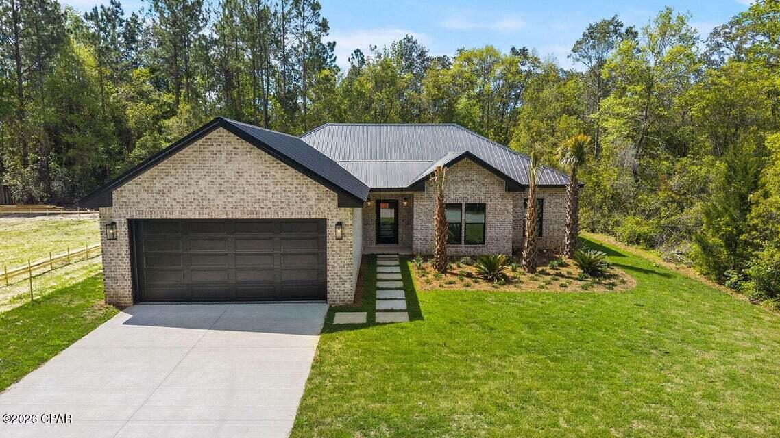 **Entered for Comp purposes only** Luxury details and thoughtful design make this 4-bedroom, 2.5-bath home in Freeport one you won't want to miss! Offering approximately 1,928 square feet, the open floor plan features custom trim, LED tray ceilings, upgraded lighting, and beautiful finishes throughout. The kitchen stands out with Bosch appliances, a waterfall quartz island, gold accents, soft-close cabinetry, and a walk-in pantry with built-ins.

The primary suite features backyard views, a custom walk-in closet, and an impressive bath with a floor-to-ceiling tiled wet room, three showerheads, oversized freestanding soaking tub, floating dual vanities, and Taj Mahal countertops. Three additional bedrooms are located along a separate hallway for added privacy.

Double doors open to the covered back porch and large backyard with plenty of room to create your ideal outdoor living space. Additional features include impact-rated windows and doors, a whole-home water filtration system, tankless electric water heater, irrigation system, and a two-car garage with epoxy flooring. Conveniently located in Freeport with no HOA and just a short drive from 30A and the beautiful beaches of the Emerald Coast.