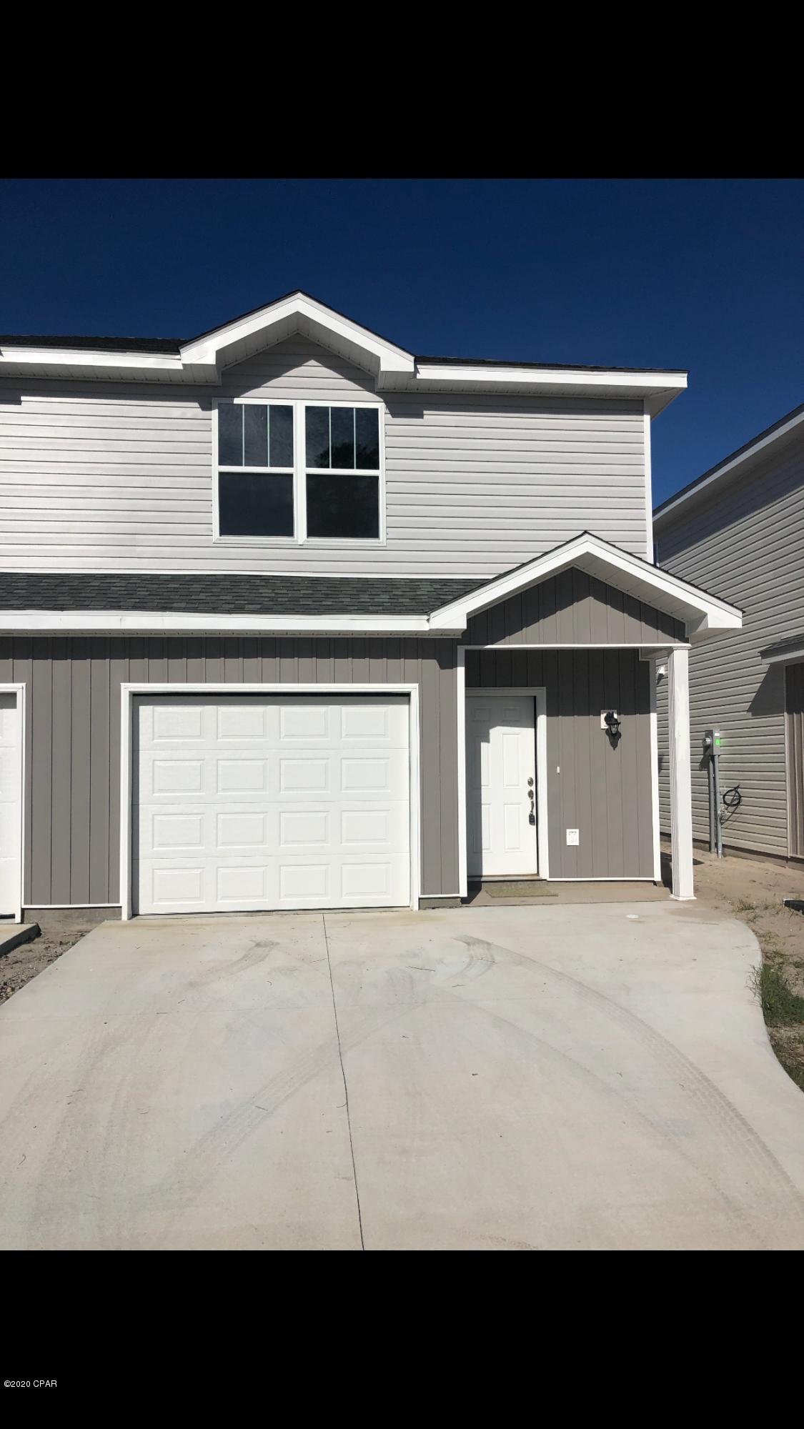 Beautiful town home, located close to beaches! Kitchen has white cabinets, granite counter tops and stainless appliances. Gray plank laminate flooring all throughout the downstairs living area w/ carpet throughout upstairs bedrooms. Laundry is also upstairs for added convenience. 3 bedroom 2.5 bath. large closets, Master with walk-in and double sinks in master bath, 1 car garage, close to Beach, shopping, restaurants and Navel Base
