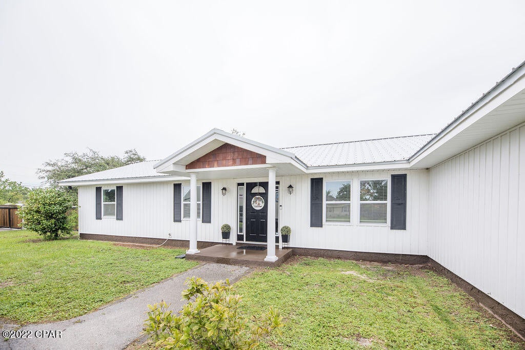 'CURRENTLY UNDER CONTRACT, SELLER ACCEPTING BACKUP OFFERS' Don't miss out on this stunningly remodeled home in the heart of Lynn Haven! The incredible kitchen is the center of attention in this open concept, 3 bedroom, two bathroom home. The living room contains vaulted ceilings, tons of natural light, and a gorgeous fireplace to decorate year round. The extra large bonus room has wall length custom built in shelves and desk/workspace area. Located on a rare half acre lot, this property also boasts a large in ground swimming pool, outdoor firepit, storage shed and huge shop. There is plenty of room and storage for boat and/or RV parking. You can enjoy indoor and outdoor entertaining with all the space this home has to offer. No HOA and just 20 minutes to the beach, 5 minutes to the public Come take a look at this unique and must see property!