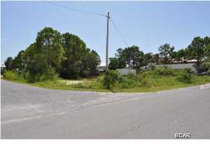 **PRICE IS FIRM** Large corner lot across from Grand Lagoon. Lot size is approx. 100x115 and can be subdivide. County zoning. You are convenient to several boat ramps on the lagoon and a short walk to the beach. Great place to build a big home or two smaller properties. All info is approx. and must be verified by Buyers if important.
