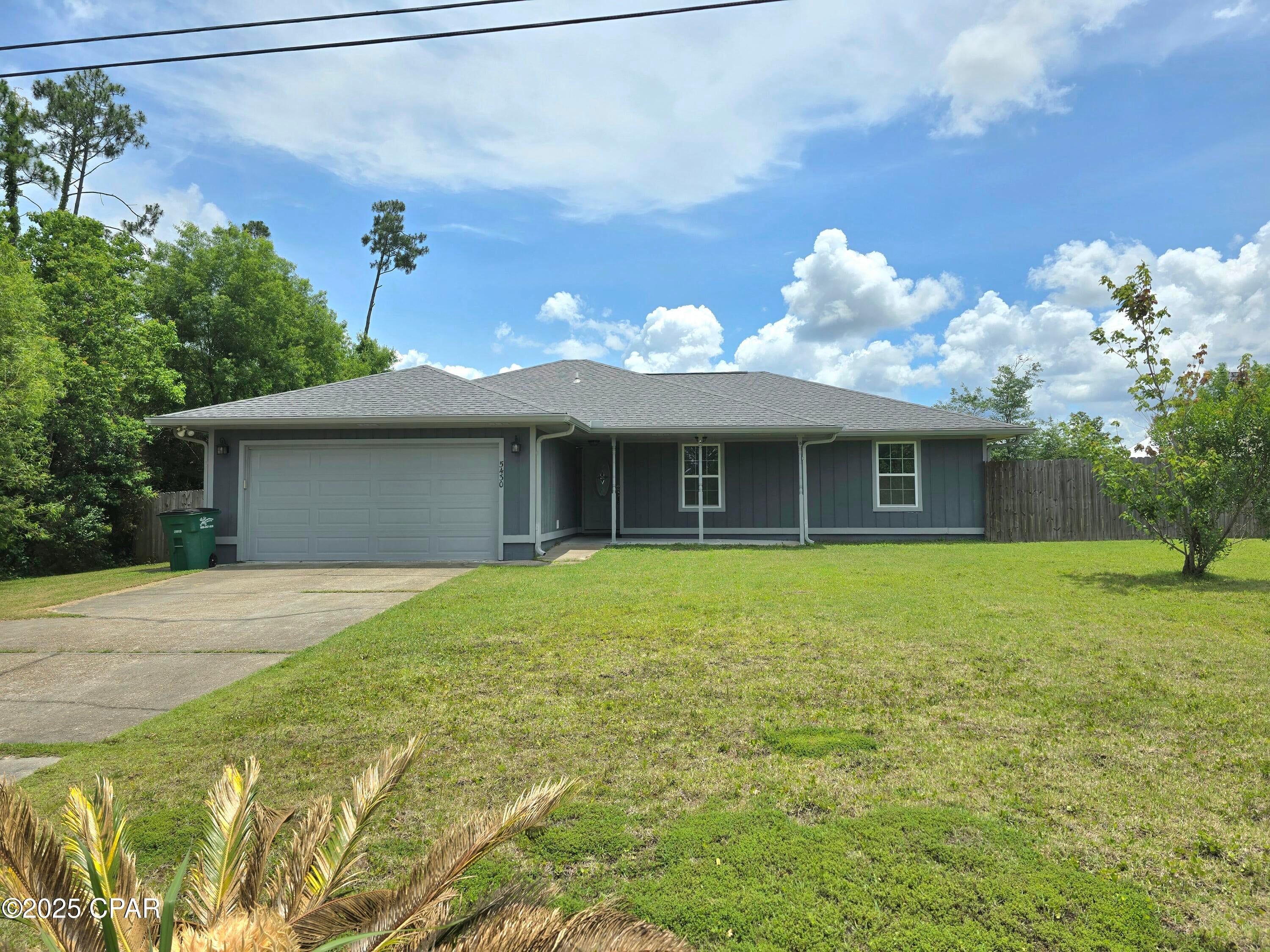 Welcome to this charming 3 bedroom, 2 bathroom home located in Panama City, FL. This cozy house features a beautiful stone fireplace, LVP flooring throughout, and a spacious open kitchen with tile accents. The kitchen also boasts a lovely window that lets in plenty of natural light. Step outside to the big fenced backyard with a pole barn and double gate, perfect for outdoor entertaining or simply enjoying the sunshine. The bathrooms are tiled for easy maintenance and a touch of elegance.
