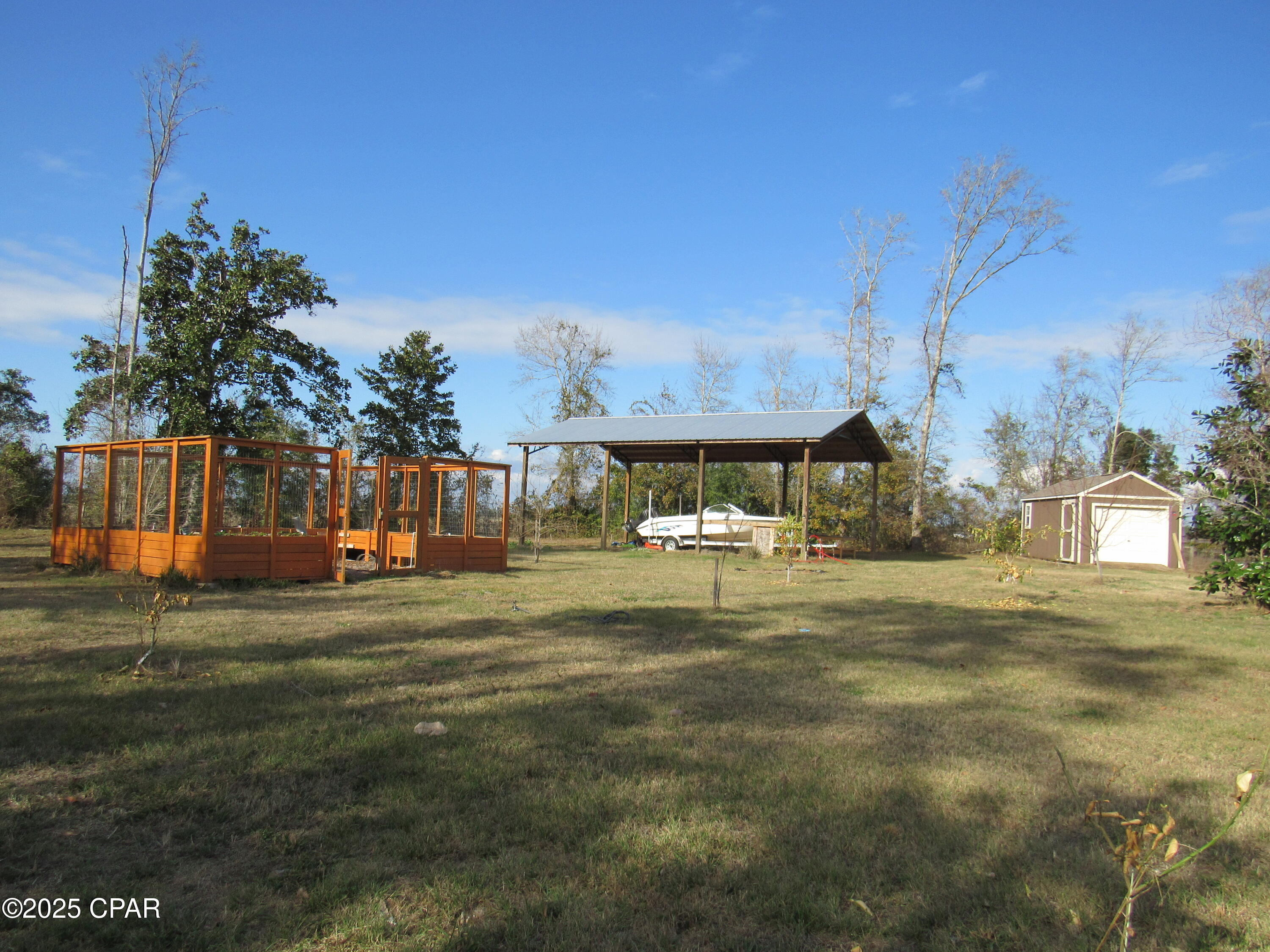 Gorgeous, manicured, and completely fenced over 3 acres! This property offers peace and privacy as it is bordered on two sides by the McCall sod farm! There are fruit trees, magnolias, sweet gum, and bay trees! This property boasts a 24x36 pole barn, a 8x12 utility shed that has washer/dryer hookups, and an enclosed garage. There is a beautiful walk-in garden that is enclosed, with raised beds! Water and electricity already in place! 2 RV connections available that offer both 30amp and 50amp! What more could you dream for?! This property is just waiting for you to build your dream home! Don't miss out, call to schedule an appointment today! Please verify all measurements and information.