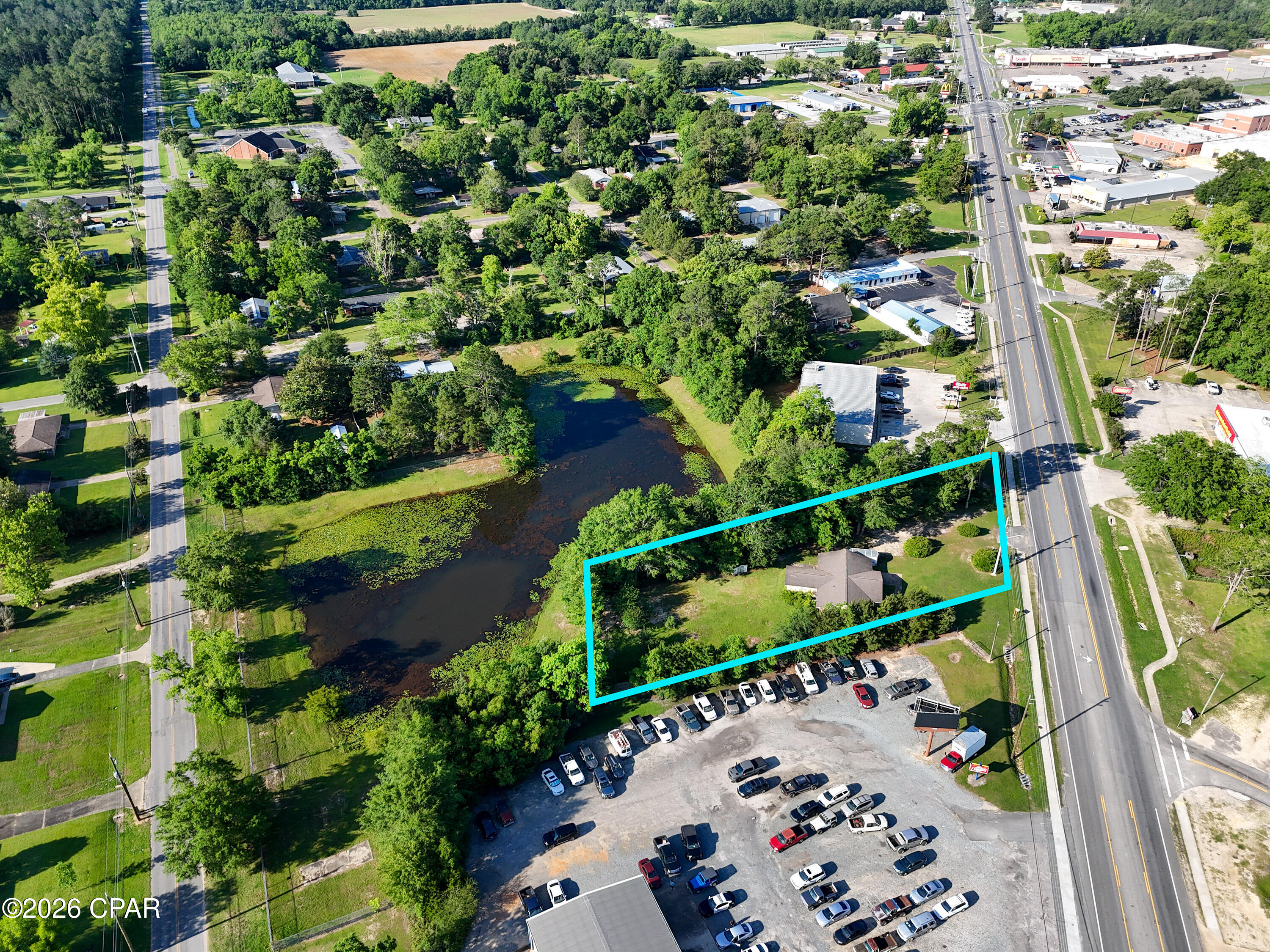 Positioned in a commercial zoning district with an average daily traffic count of 14,500 (2023 DOT Data), this versatile brick property offers exceptional potential for business, investment, or mixed-use occupancy. Currently configured as a 3-bedroom, 1.5-bath home with a full kitchen, the layout easily adapts to a variety of commercial uses including professional office, retail, medical, salon, service-based business, or live/work setup.

A dedicated front entry creates the perfect reception or waiting area, while two separate living spaces provide flexibility for conference rooms, private offices, collaborative workspace, or client meeting areas. The functional floorplan allows for multiple business configurations without extensive renovation.

Outside, the oversized yard provides substantial room for parking, equipment storage, fleet vehicles, or future expansion. Important note: the fence visible on the right side is not the property line -- the property extends to the second chain link fence, providing additional usable space.

This property also presents a strong investment opportunity: house employees or tenants on-site while operating your business, or utilize the space for combined residential and commercial income potential. High visibility, flexible zoning, and adaptable space make this a rare opportunity for owner-users and investors alike.
