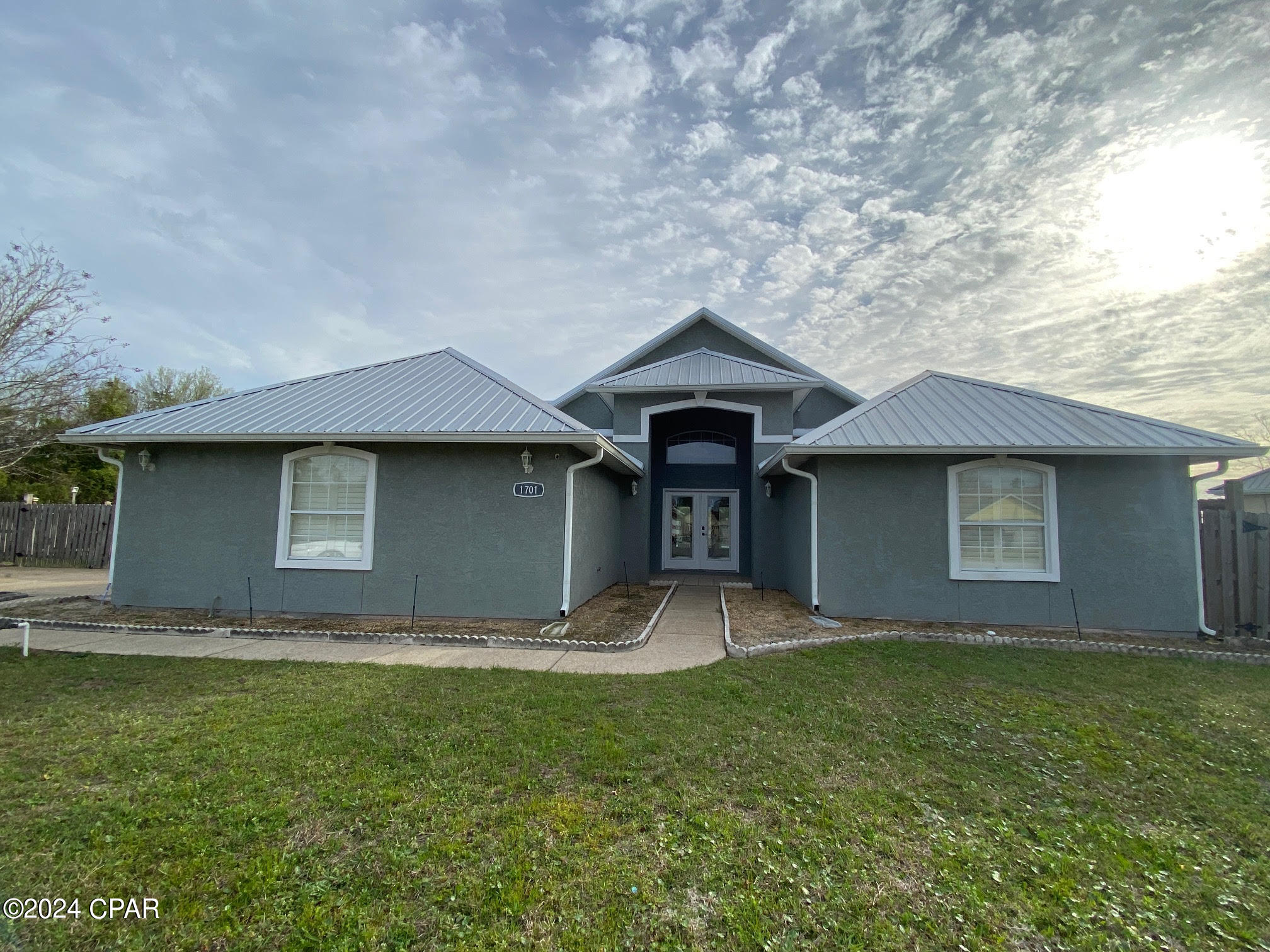 LIKE NEW 3bd 2ba 1,707 sqft - but with a heated and cooled garage that adds another 500sqft - Executive home with an in-ground salt water pool at the end of a cul-de-sac in Mowat Highlands. Metal roof, new LVP flooring, new interior paint, recessed lighting, plantation shutters, security cameras. Mbath has walk-in closet, garden tub & double shower. Covered back patio, privacy fenced. 2 car garage with tons of cabinets/storage space. Washer/dryer included. **Pool service and Landscaping included; note - cannot use fireplace** Pets negotiable, restrictions & pet deposit apply. EMAIL OFFICE FOR RENTAL REQUIREMENTS AND SHOWING INSTRUCTIONS, DO NOT CALL AGENT. Rentals@crpm850.com