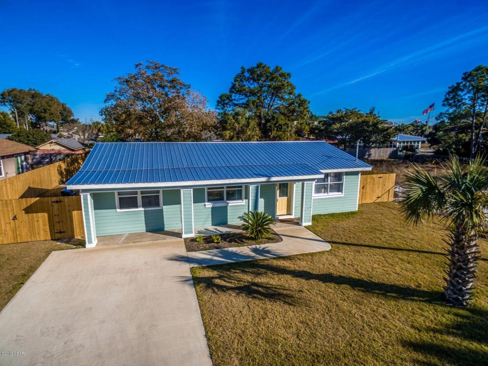 Welcome to the Salty Dog Retreat! This 3 bedroom, 2 bathroom beach cottage is located in the Thomas Drive area and is convenient to the beach, restaurants and attractions.  Enjoy lounging in the hot tub after a long day at the beach! This luxury series hot tub seats 7 and features LED lighting and a waterfall. Interior features of the home include wood laminate flooring throughout, granite counter tops and stainless steel appliances in the kitchen, and a jetted tub in the master bathroom. Comfortably sleeping 10 occupants, this home has a king bed, a queen bed, two double beds, and a queen sofa sleeper in the living area. Exterior features include a fully fenced backyard, hot tub, deck, gas grill and outdoor shower. Beach access is approximately 500 yards away. Pet negotiable with $250 non-refundable pet fee. 6 month lease term available. Stacked/Washer dryer included.