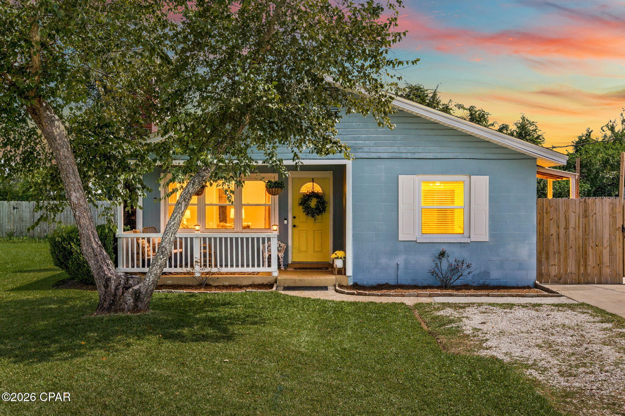 **Open House, Sunday, September 27th, 3-5pm** Single-Level Block Home in Lynn Haven with a spacious Fenced Backyard!

Welcome home to 1005 Mississippi Ave, a charming 3-bedroom, 1-bath block home with a sunny yellow front door, a rocking-chair front porch with the perfect view of the beautiful Florida Sunsets, and a backyard that keeps going. Inside, neutral paint runs from ceiling to baseboard, crown molding finishes every room, and warm bamboo floors carry through the living areas and bedrooms.

The living room centers on a working gas fireplace that becomes the heart of the home. Large updated windows allow for plenty of natural light. The eat-in kitchen has stainless appliances, plenty of cabinet storage, and a pantry closet, and the dining area is finished in green wainscoting & a beautiful modern chandelier. The laundry is conveniently located, and the stackable washer/dryer does convey. The updated bath has a vessel sink and a window for natural light.

Out back, a patio is ready for evenings outside - just bring your outdoor furniture to set the right mood. The fully fenced yard leaves room for gardening, games, playgrounds, or pets. The large storage shed with windows conveys, and the playset can stay or go, whichever you prefer. You get single-level living with manageable upkeep, just minutes from Lynn Haven's parks, shops, and quiet waterfront. Schedule your showing today!