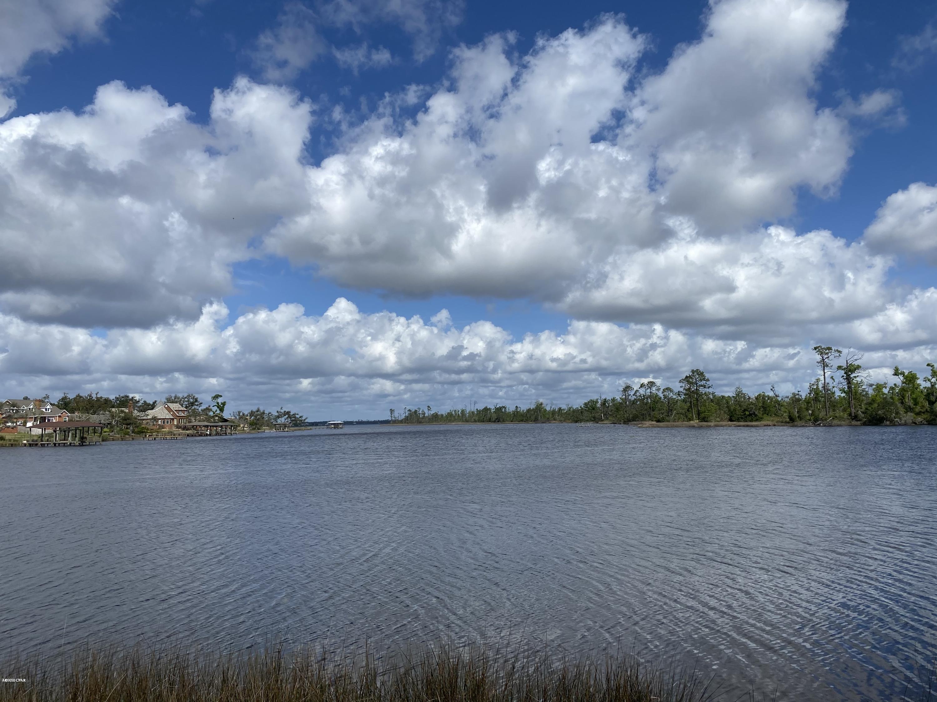 Waterfront 1/2 acre lot in The Meadows & The Point subdivision located at the end of the street on a cul-de-sac, this lot offers privacy and tranquility! Perfect for building a waterfront home and taking advantage of the nearby golf course. Lot offers mature oaks along with existing spectacular wooded area. All sizes and school zones are approximate