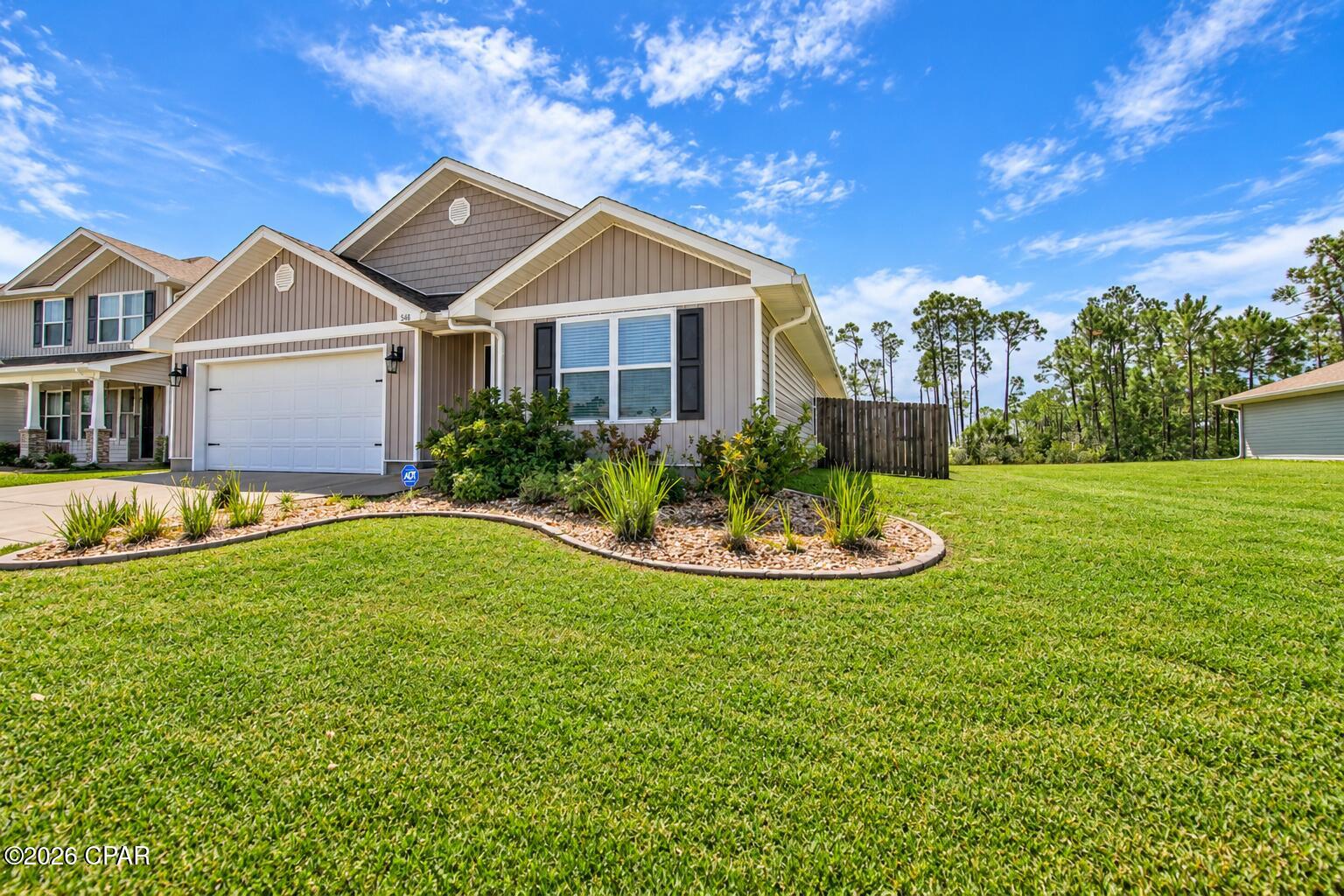 Welcome to this beautifully maintained 4 bedroom, 2-bathroom, home located in the desirable Bridge Harbor community with views of the bay from your back screened in patio. Built in 2020, this thoughtfully designed Cali floor plan offers open concept layout, split bedroom design, and comfortable one level living. 

Step inside to find durable LVP flooring, 8-foot ceilings, recessed lighting, and a spacious living area that flows seamlessly into the kitchen and dining spaces. The kitchen features a large island with breakfast bar seating, stainless steel appliances, a walk-in pantry with added shelving, and plenty of cabinetry for storage. 

The primary suite is tucked away from the additional bedrooms and features a spacious bedroom, dual vanities, soaking tub, separate walk-in shower, and walk in closet. Three additional bedrooms and a full bathroom provide plenty of space for family, guests, or a home office. 

The home also offers a dedicated laundry room with additional cabinetry, a covered porch, gutters, a screened in back patio overlooking the fenced backyard with peaceful views of the bay through the surrounding tree line.