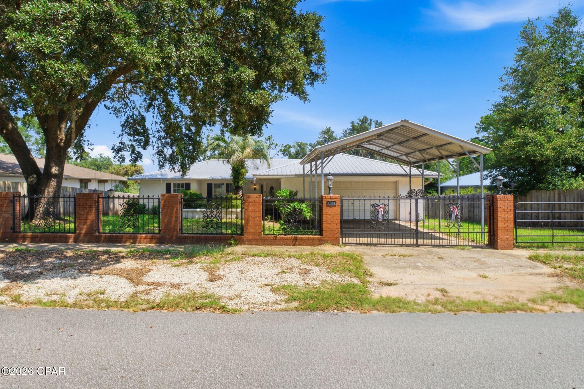 Wake up to peaceful lake views and enjoy a home where the setting is just as inviting as the spaces inside. Situated along Watering Lake in the Sunny Hills community, this updated 3-bedroom, 2-bath block home offers 1,776 square feet with an open layout designed for comfortable everyday living and easy entertaining. Fresh paint and new wood laminate flooring give the interior a clean, updated feel, while the kitchen opens naturally to the main living and dining areas. A separate den/flex room adds valuable versatility, creating the perfect spot for a home office, playroom, hobby space, or second living area. Both bathrooms feature beautifully tiled showers, and the split-bedroom design provides added privacy. Spend quiet mornings in the sunroom overlooking the water, step outside onto the deck to relax and enjoy the view, or take advantage of the fully powered workshop for projects, storage, and outdoor gear. Fruit trees and flowering plants add character to the property and complement the tranquil lakefront surroundings. When you're ready to get out and explore, Sunny Hills offers nearby access to Boat Lake, Sunny Hills Golf Club, a playground, basketball court, skate park, and library. Enjoy the peaceful surroundings of Watering Lake while remaining within driving distance of downtown Chipley and Panama City. A wonderful opportunity for anyone looking for more space, beautiful views, and a little extra room to slow down and enjoy home.
