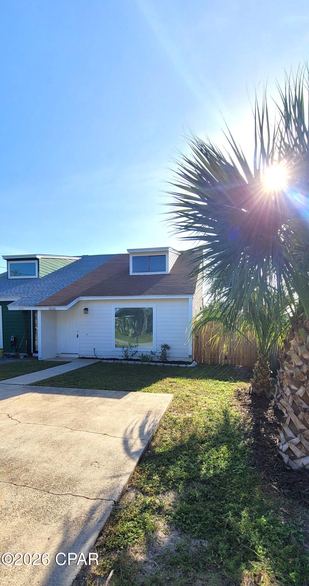 This centrally located, two-story townhome features 2 bedrooms and 2 bathrooms split floor plan. The unit has been recently remodeled and offers an open living area, a kitchen with a breakfast bar, one bedroom, one full bathroom, and a laundry room with W/D hookups downstairs. Upstairs, you will find the master bedroom, a master bathroom, and a flexible open loft area overlooking the main living space that can be used as a bonus room or home office.
Additional features include a privacy-fenced backyard with a covered patio.
The property is located in a designated flood zone.  Pets are not allowed.
4.8 miles from the Navy Base and 19.7 miles from Tyndall Air Force Base.