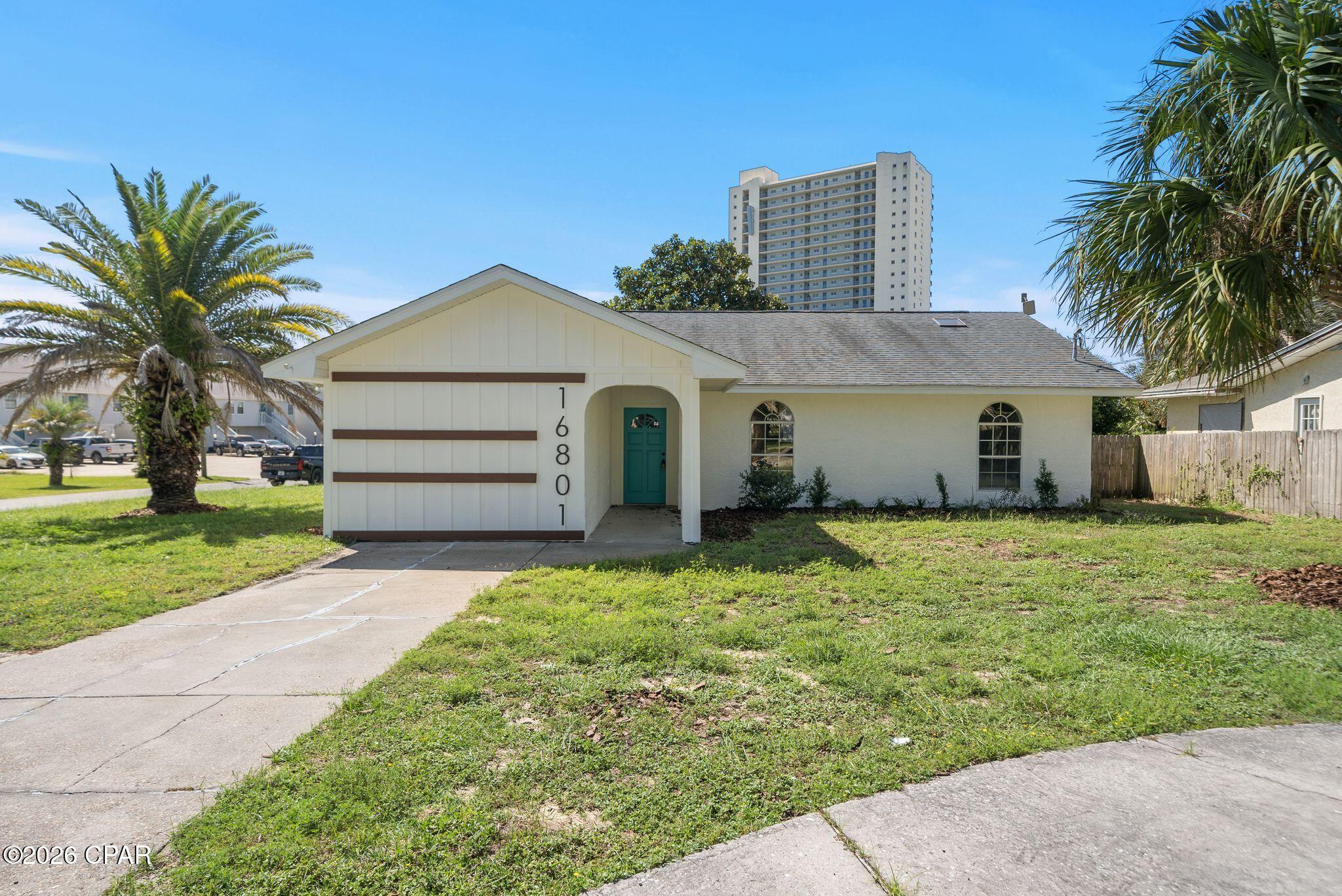 UPDATED, FULLY FURNISHED and ready for new owners in Panama City Beach! This beautifully refreshed 3-bedroom, 3-full-bath home with a LARGE BONUS BUNK ROOM offers a fun coastal feel with stylish finishes and plenty of character throughout. Step inside to an inviting living space featuring vaulted ceilings, new LVP flooring, and a bright, airy color palette. The kitchen has been updated with white cabinetry, stainless steel appliances, a coastal-inspired tile backsplash, and a large statement island offering plenty of space for gathering and entertaining.

The home offers plenty of room for family and guests, with three bedrooms plus a large bonus bunk room providing flexible additional sleeping or living space. All three full bathrooms feature clean, updated finishes, including tile surrounds, updated vanities, fixtures, and lighting. Pops of coastal blue, warm wood tones, and thoughtfully selected finishes give the home a relaxed PCB vibe without sacrificing style.

The location is hard to beat, just minutes from Pier Park, putting shopping, dining, entertainment, and some of Panama City Beach's most popular attractions close by, along with less than a mile golf cart ride to beach access to the beautiful Gulf beaches.

Whether you're searching for a primary residence, beach getaway, or investment opportunity, this move-in-ready home offers the space, updates, and location you've been looking for. Updated, spacious, and ready to enjoy, PCB living starts here!
Each bedroom has its own personality, while the updated bathrooms feature clean, modern finishes including subway tile, updated vanities, fixtures, and lighting. Pops of coastal blue, warm wood tones, and thoughtfully selected finishes give the home a relaxed PCB vibe without sacrificing style.

Outside, the home's charming exterior, arched windows, covered entry, and tropical surroundings give it plenty of curb appeal. Whether you're searching for a primary residence, beach getaway, or investment opportunity, this move-in-ready home puts you right in the heart of Panama City Beach and close to everything that makes coastal living so much fun.

Updated, stylish, and ready to enjoy... all that's missing is the new owner!