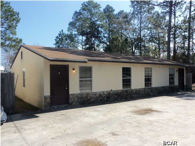 TWO DUPLEX BUILDINGS - (4 Total Apartments) - Each apartment is 2BR/1BA (740+/- Sq Ft each). Recently PRICE REDUCED - now each apartment valued under $30K...at current rents this property could pay for itself in 6 years or less! Centrally located off Transmitter Road with handy access to Hwy 98 (15th St) or Hwy 231. Stucco w/stone accent construction, shingle roofs, concrete drive/parking pads. Laundry Hook-ups in each unit. [As of 2/10/2015: 3 units are rented....Apt D recently vacated - installing new flooring - owner says there is tenant in the wings awaiting unit prep] - All Electric - TENANT'S PAY OWN UTILITIES (elec/water/sewer/garbage)...Owner only provides monthly lawn maintenance - as needed. Current (Bay County) tax assesed value is over $100,000. An owner occupant