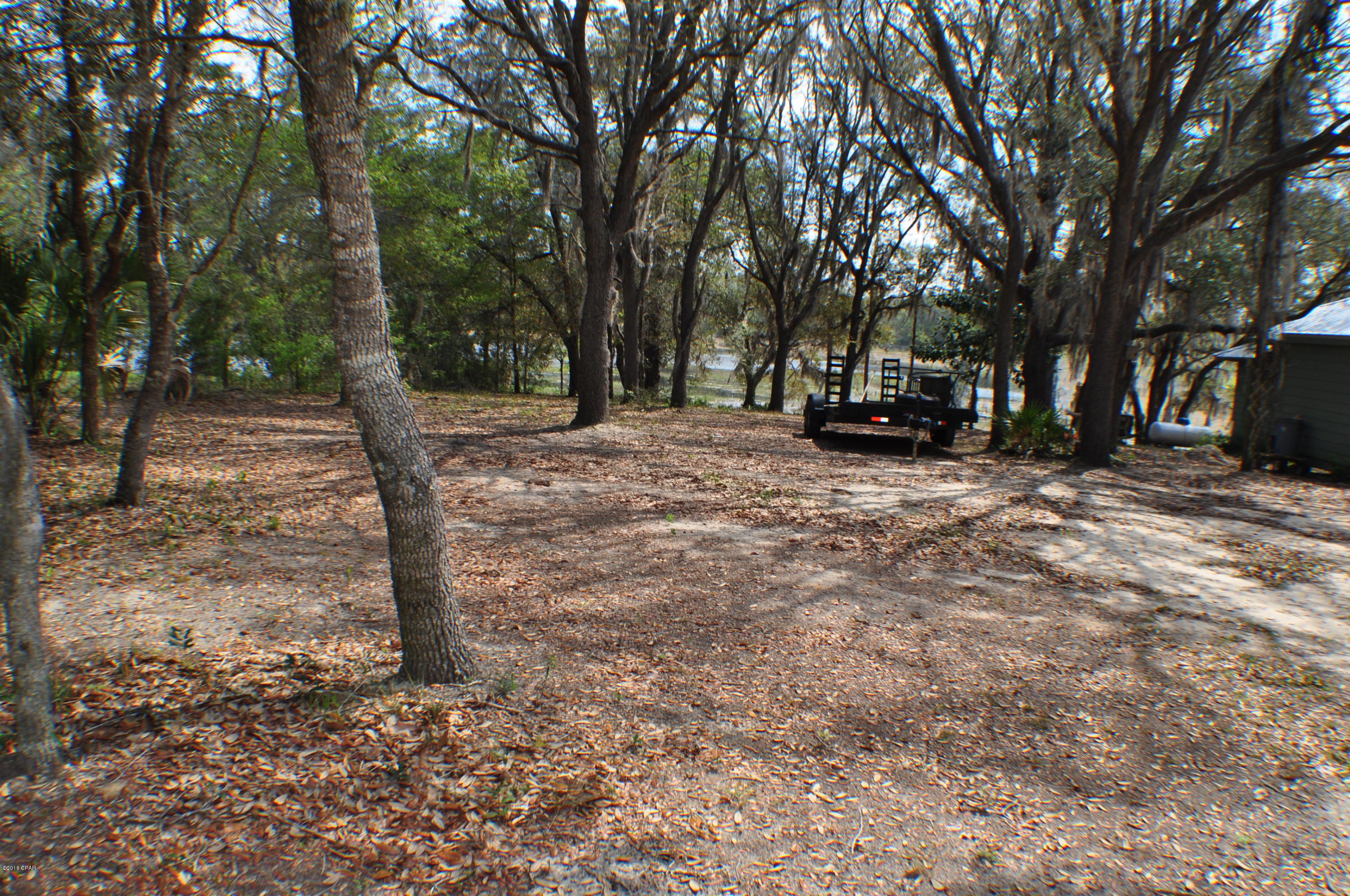 CURRENTLY UNDER CONTRACT, SELLER ACCEPTING BACKUP OFFERS.  Lake front lot near Hwy 20.  Approx 65x200 with well and septic on the property.  Great for building a home or bring in a mobile home.  All info is approx. .