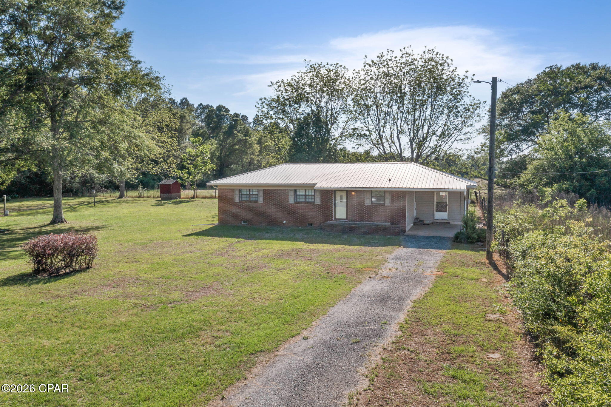 *****Reduced And Selling AS IS***** 

Charming Country Brick Home -- 2 BR, 1.5 BA located minutes from town.

Updated and move-in ready single-story home on a beautiful 1-acre lot. Bright kitchen with abundant cabinets, generous counter space and a breakfast bar; adjacent dining room for everyday meals. Large living room and two nicely sized bedrooms.

Exterior & outbuildings:
- Concrete-floor carport that doubles as a covered patio
- Workshop with lean-tos -- great for mower/yard tool storage
Additional front carport w/ adjacent dedicated washroom/storage 

Comfortable area for country living. 

 Property has plenty of room for a vegetable garden or a flower garden.

 Would be perfect for a starter home or downsizing option.

Home needs some TLC but has been reduced to a great price!!!!!!