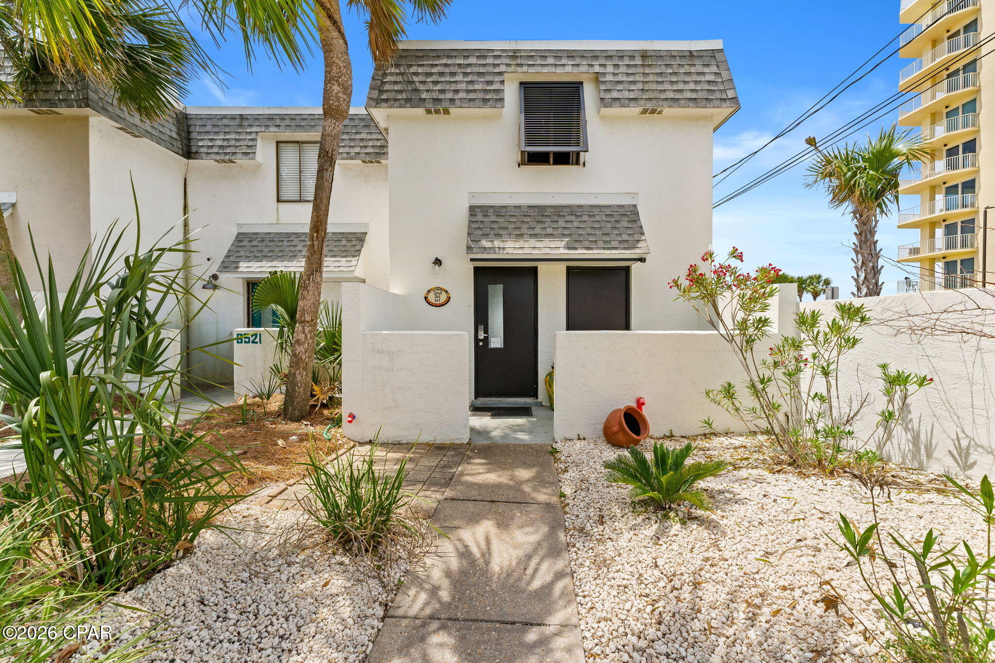 CURRENTLY UNDER CONTRACT, SELLER WILL CONSIDER BACKUP OFFERS.  BEST DEAL FOR A GULF FRONT HOME IN PCB. CASA DEL SOL is a beautiful, bright and airy, remodeled end unit next to Beach Access #22 with a Mobi mat for easy walking to the beach. New exterior paint and landscaping. Gulf Front townhome right on the beach with NO HOA  The views and sunsets are amazing along with the Gulf breezes.  All stainless steel appliances, luxury vinyl plank flooring throughout, new dual HVAC systems with new smart thermostats, newer water heater, Disposal, 3 full baths, and very nice furnishings included. This home also has roll down metal storm shutters that cover both patios, fabric for front door, and Bahama shutter. There is an outside 3x8 storage in the front and storage in back.