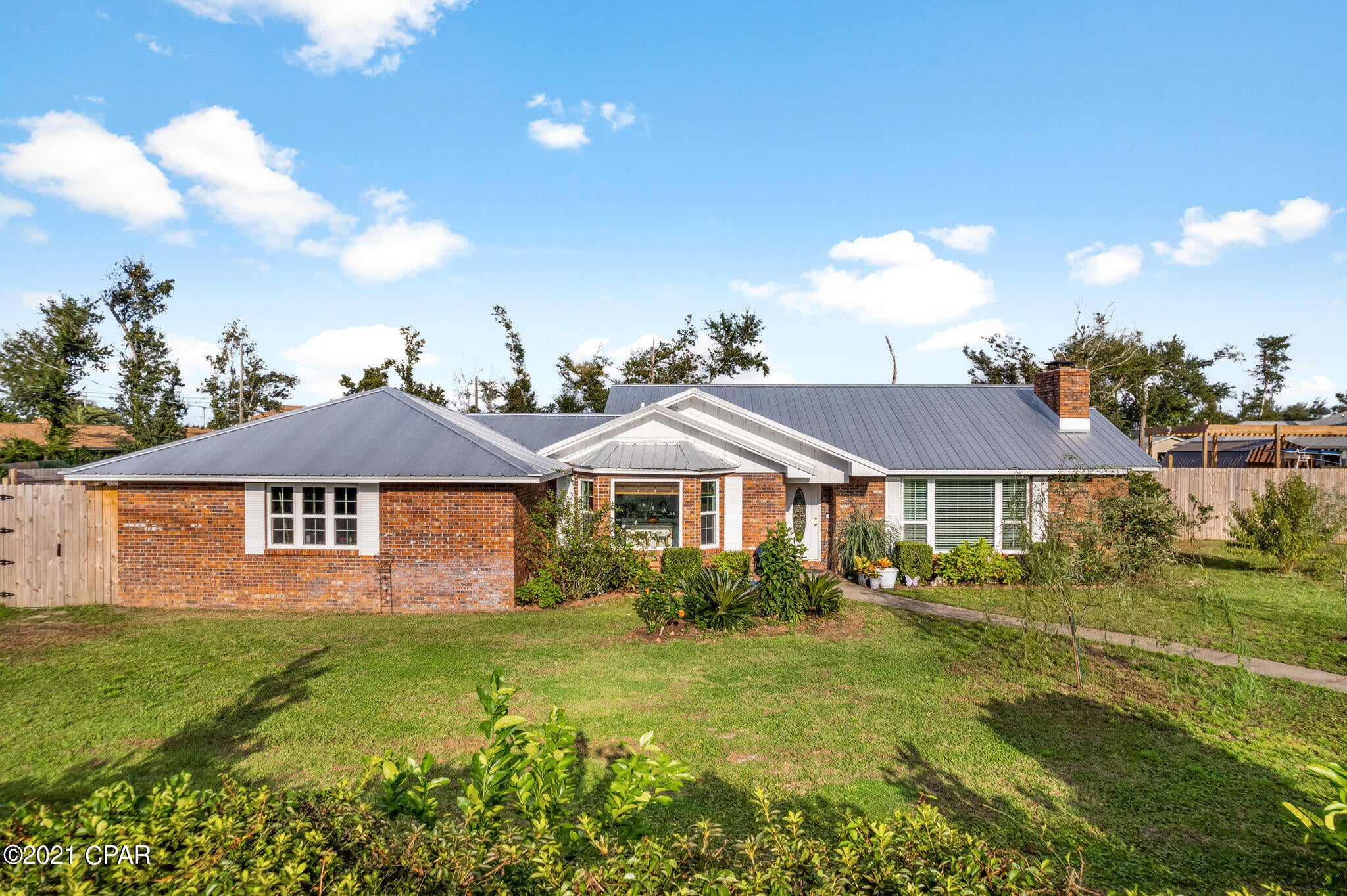 CURRENTLY UNDER CONTRACT ACCEPTING BACK UP OFFERWelcome to Lynn Haven. This home sits on a huge lot at the end of College Point; walking distance to the bay with water views. If you are looking for room to spread out and enjoy your privacy this is the home for you. This is a brick home with a solid metal roof and lots of large new windows. This home was recently renovated with new soft close custom cabinets, granite counter tops and elegant stainless steel appliances. Fresh paint and luxury vinyl plank floors throughout this home. When you first enter this home, you will notice the open living area with a seating area to your right featuring a wood burning fireplace and oversized window. To your left you will find the kitchen and island space, straight ahead is the dining area and access t ... the bedrooms, the family bathroom features a large corner soaking tub, new plumbing and fixtures, a double corner custom vanity featuring top of the line LED bathroom mirrors. In the master bathroom you will find a large deep tub shower with tile. The master bedroom features 2 closets; one walk in with plenty of space. In the second bedroom you will notice the large walk-in closet with plenty of storage. When passing through the kitchen you will find the half bath and laundry room also leading out to the garage and bonus room. This space can be used for guests, a work out room, hobby room or so much more! In the back yard you will find a small oasis with plenty of parking and room. There is a built-in fire pit and gazebo for get togethers, a large pool barn for RV parking or boat storage, a coy pond with swing and a large storage building with climate control for a hobby building, storage or studio. This home is also located just one block from a waterfront park, kayak to Deer Point Park and just 1.5 miles to the Lynn Haven sports complex.