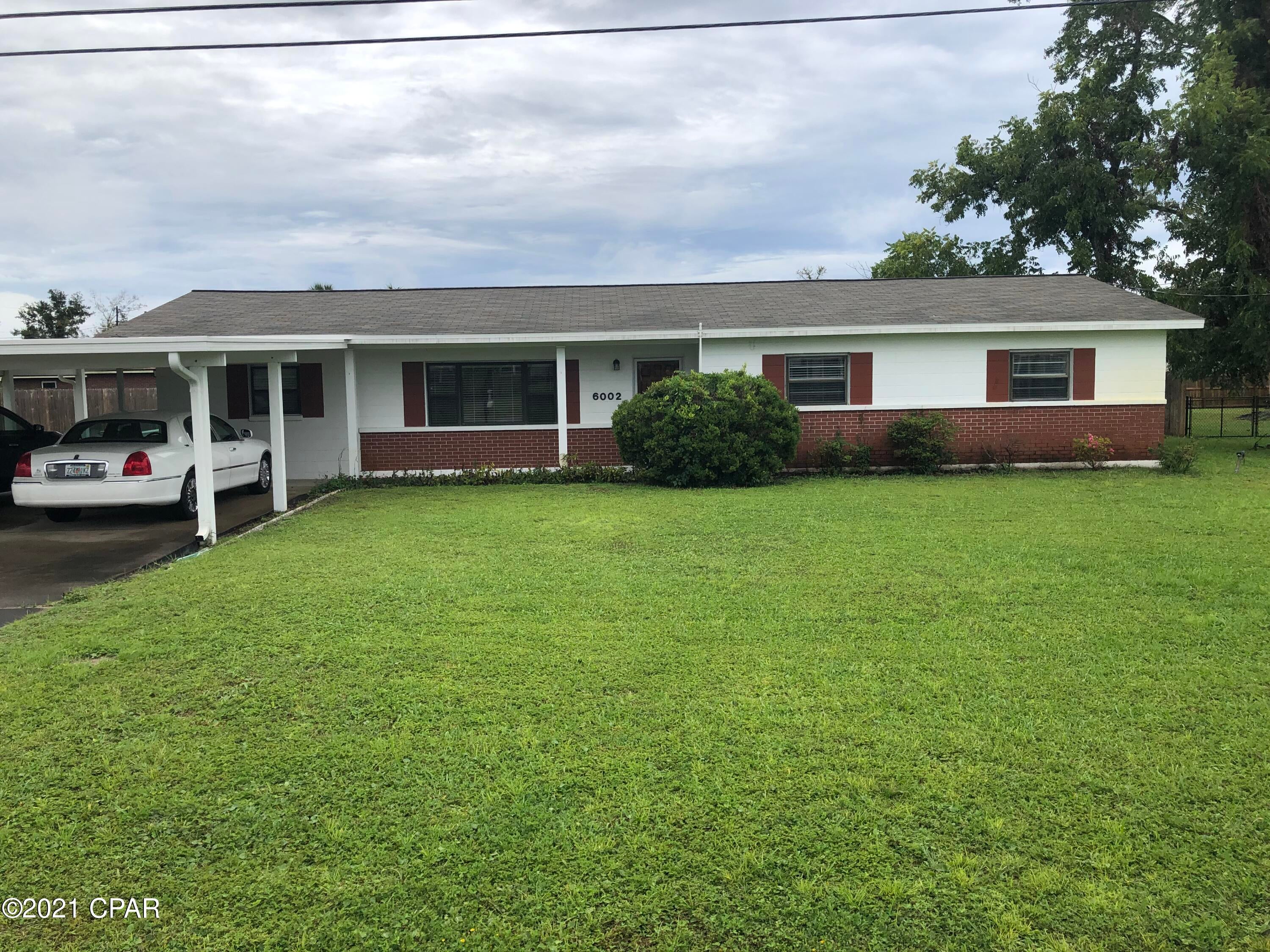 Don't miss your opportunity to own this well maintained home thoughtfully renovated after hurricane Michael. The fantastic location is close to Tyndall Air Force base, boat ramps, shopping, restaurants, and schools. This 3 bed, 2 bath home has over 1800 square feet of quality upgrades from the hardwood laminate and tile flooring to the completely redone florida room that has new windows with storm shutters on them. The large lot has a 28x60 foot work shop, built on a slab and has power to it. The sprinkler system is run off a well. The roof decking and shingles were replaced in 2019, the duct work and insulation were also replaced. and a new heat pump. Everything was done first class; even the closet lights turn on automatically when you open the doors. Contact a realtor to see it today