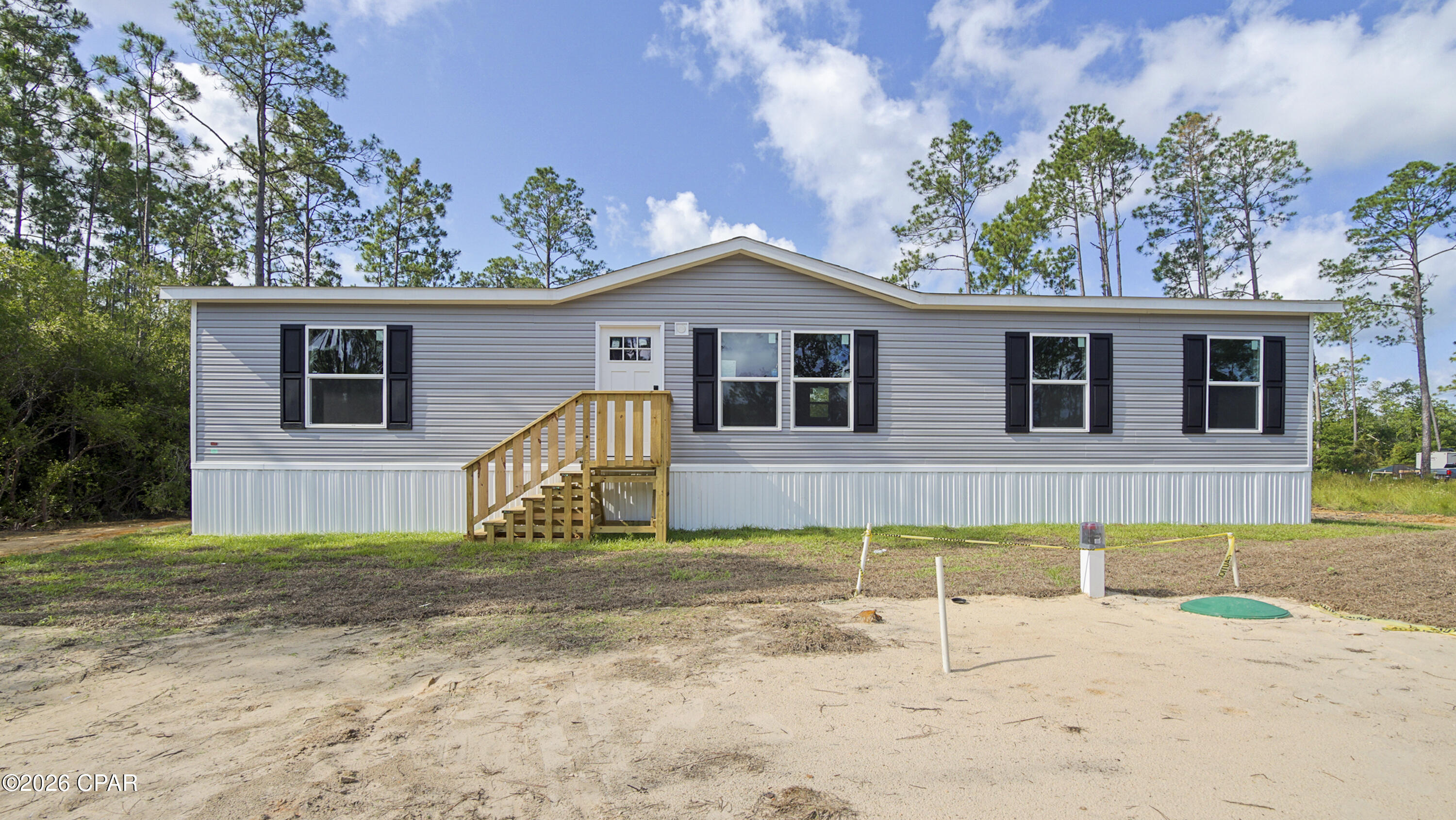 Welcome home to this beautiful brand-new manufactured home on just over ½ an acre. Offering 3 bedrooms and 2 bathrooms, this home boasts an open, spacious layout with split bedrooms. The eat-in kitchen features a breakfast bar and coffee bar and flows nicely into the dining area--perfect for everyday living and entertaining. The primary suite includes double vanities, a walk-in shower, and a large walk-in closet. Outside, you'll find sturdy walk-up steps at every entrance and a new septic system. This one is a must see!

Please verify all information and measurements for accuracy.