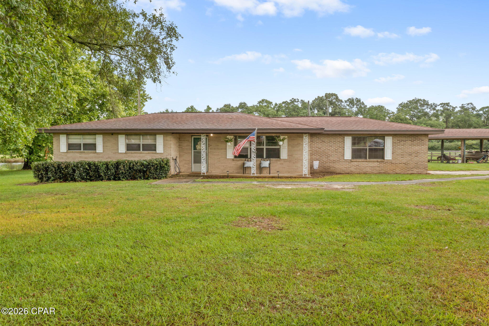 Situated on approximately 1.5 acres, this 3-bedroom, 2-bath brick home offers space, functionality, and the opportunity to make it your own. Inside, the open living, dining, and kitchen area creates a comfortable layout for everyday living and entertaining, featuring ample cabinet space and a breakfast bar. The primary bedroom includes a private bath with a tiled shower, while the spacious 16x21 bonus room provides flexibility for a home office, playroom, media room, or potential 4th bedroom. Outside, enjoy the large backyard featuring a newly added fence, offering added space for pets, play, or outdoor gatherings. The property also includes two outbuildings and a 3-bay barn, providing plenty of room for storage, hobbies, equipment, or covered parking. With a quiet country setting and room to make it your own, this property is full of potential.