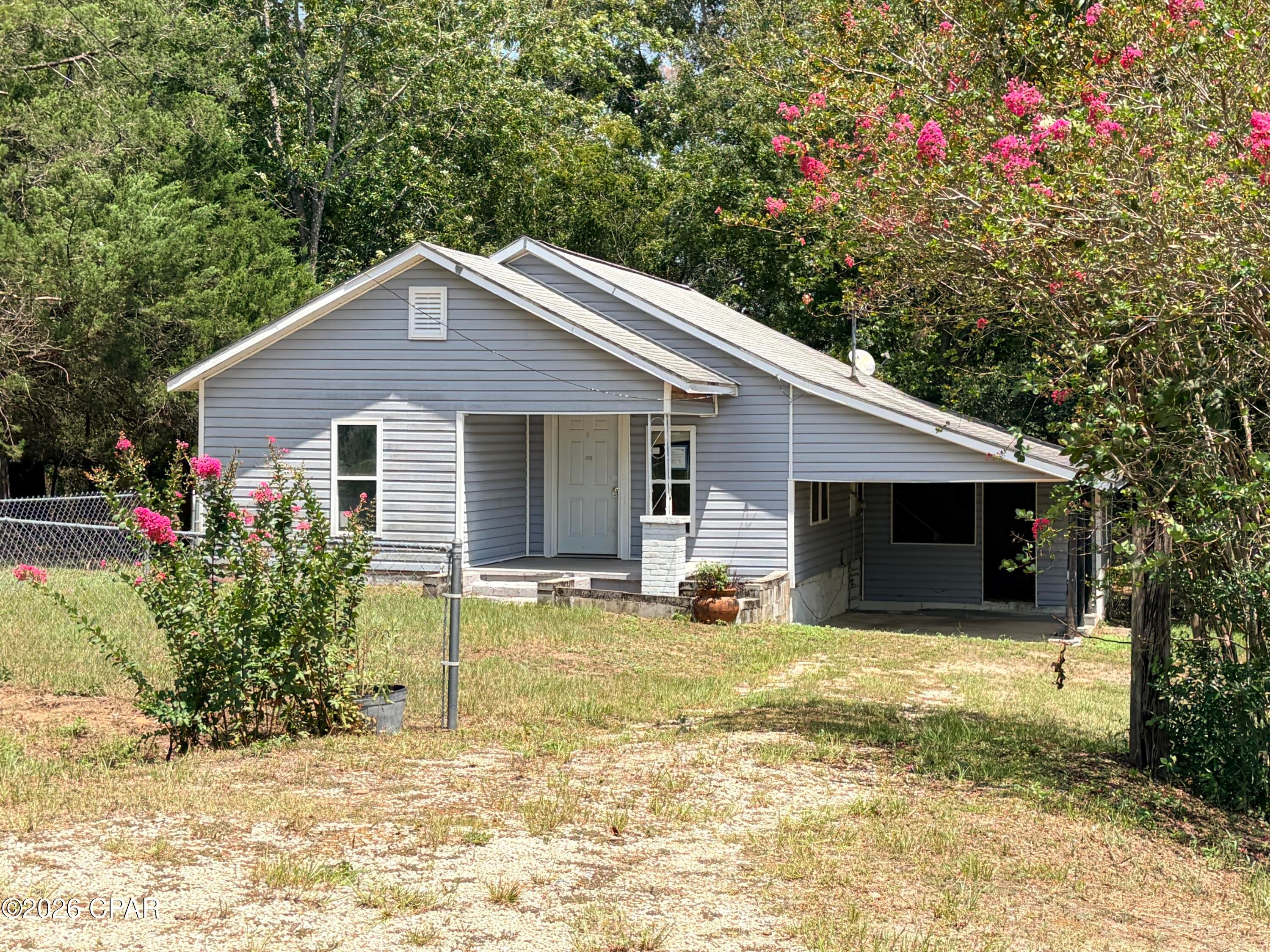 Country style, country road and a lot of property for the price!  This home sits on over an acre, with 2 bedrooms and 1 bath.  There is a storage barn on  the lot and the expansive views of countryside are lovely.  New floors and new paint would make this home shine!  Seller to look at Owner Occupant offers on morning of 9/8, so call your favorite realtor today! (All info is approximate and buyer to verify any info that is important.)