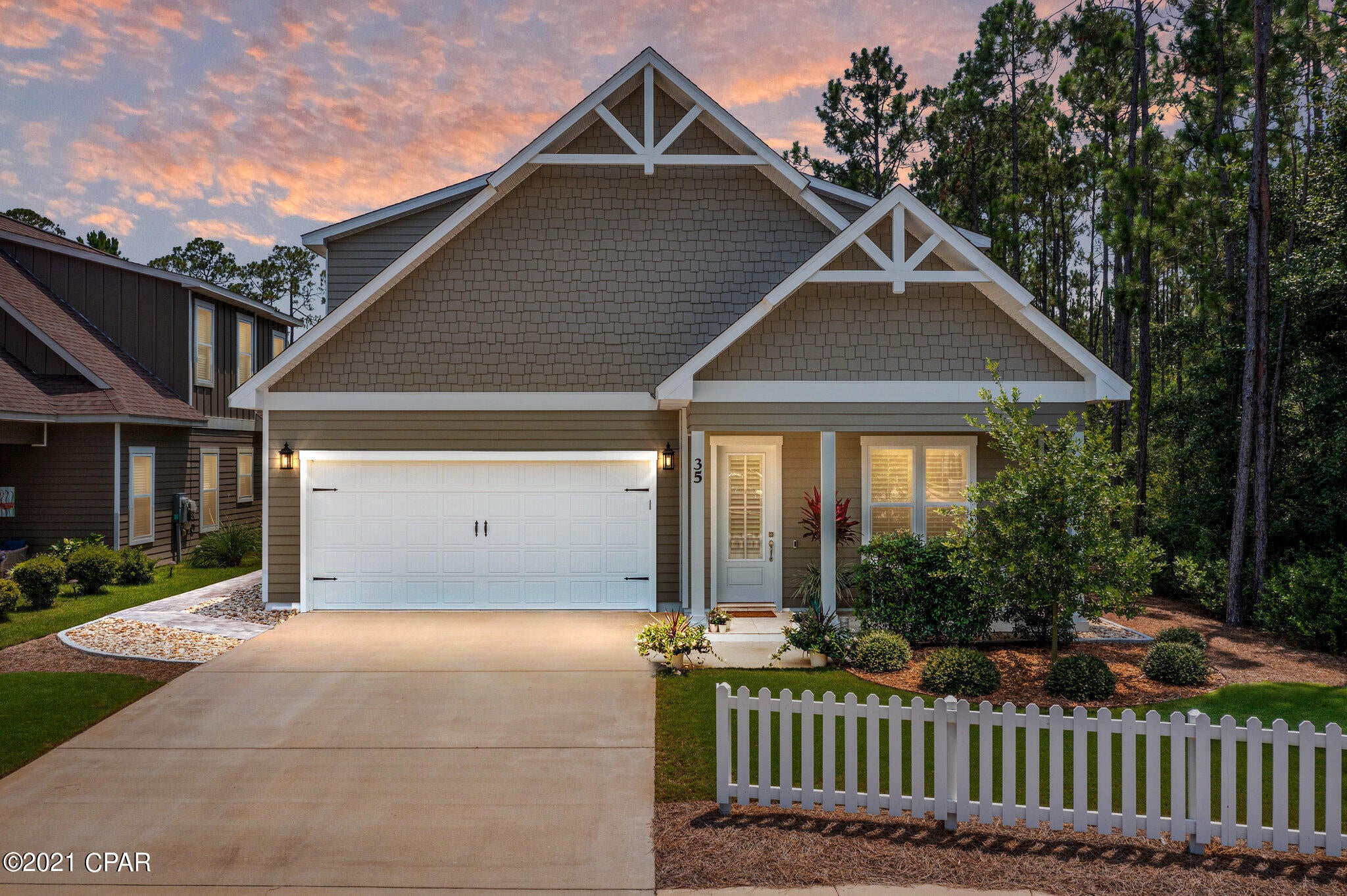 You will love this stunning 5-bedroom, 3.5 bath home with a 2-car garage in beautiful Paradise Cove! This home is sure to please and presents ample upgrades throughout. This home is tucked against the nature preserve providing unparalleled privacy and serenity. It features exquisite interiors with an innovative floor plan and an inviting open concept. The first-floor master suite opens to the screened porch, the oversized master bath offers dual vanities, a garden tub, a walk-in shower, and a walk-in closet. The second floor offers 3 guest bedrooms, 2 full baths, and a media area. The large kitchen features stainless steel appliances, granite countertops, a breakfast bar, and custom soft-close cabinetry.  Click ''More'' for additional information. The open floor plan features 10' ceilings with crown molding, and the living room with fireplace opens to the screened porch with TV and paver patio area with additional seating.
 
Upgrade highlights include light fixtures, LED lighting, kitchen backsplash, hardwood floors throughout main floor, plantation shutters, fencing, landscaping, fruit trees, paver paths, rock drainage around the entire house, a garage keypad, and additional storage space. There is also a water softener system for the entire house plus a reverse osmosis system for the kitchen sink and fridge line. Large media filters are in both air conditioner units. 
 
Situated in a friendly community conveniently off Highway 98, just minutes from 30A beaches and Seaside, close to newly constructed schools and not far from the local's favorite shopping, dining, and entertainment attractions. The subdivision features a private community pool with bathrooms and parking, a greenspace, and 4-acre pond. This property is a must-see.