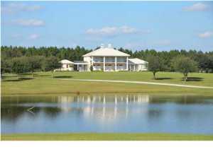 Tradition, charm, grace... elements embraced at Twin Falls Plantation, in the heart of Northwest Florida. If you've ever dreamt of a luxurious private estate amid an Old South setting, Twin Falls Plantation is your dream transformed into reality. The Antebellum style home, exudes Southern Charm with a modern flare is located in Walton County, only 25 minutes north of the sugar-white sand beaches. Twin Falls Plantation encompasses more than 650 secluded acres of manicured uplands, wooded bayous and spring-fed lakes. Twin Falls Plantation is named for two waterfalls found along Bruce Creek, which meanders through the property, a tributary of the Choctawhatchee River. The plantation home, built in 2004, includes 21 Tuscan columns with 14 ft. ceilings, 8 ft. doors and features two wings.