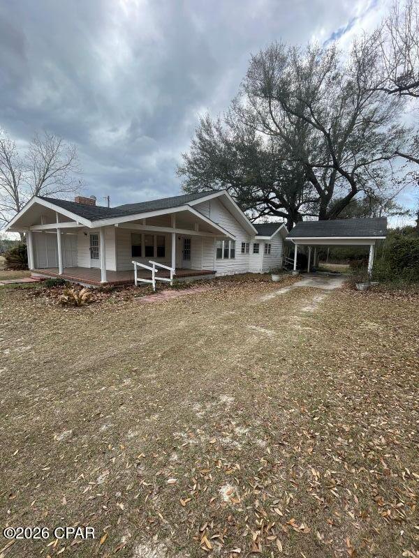 $225,000. PRICE IMPROVEMENT! If the country is calling you, check out this comfortable 3-BR, 2-bath home on 2+ acres just 3 miles to Chipola River boat launch for good fishing and/or boating activity! With 1759 sq. ft. of heated/cooled living space, this 1950 home has had remodels and updates over the years. The L-shaped porch faces the paved county road and is 8' x 14' on one side and connects to an 8' x 24' front porch. Kitchen has plenty of cabinets and is equipped with new GE stainless stove and refrigerator, and a white dishwasher. Wood paneled walls grace the kitchen, breakfast nook, utility/storage room, and one of the BR's, while the paneling in 2 BR's and living room are painted, and the dining room has wallpaper plus a nice built-in cabinet with drawers and shelves for storing and/or displaying china. Formal dining room and living room are separated by pretty French doors and the living room has a brick fireplace, flanked with bookshelves on either side. The master BR suite has 2 closets and a very spacious bathroom. This country gem is located just 8 miles from Blountstown and about 35 miles from Panama City for shopping, medical, and the Gulf Beaches! Add this one to your list of homes to view... you'll be glad you did! $225,000.