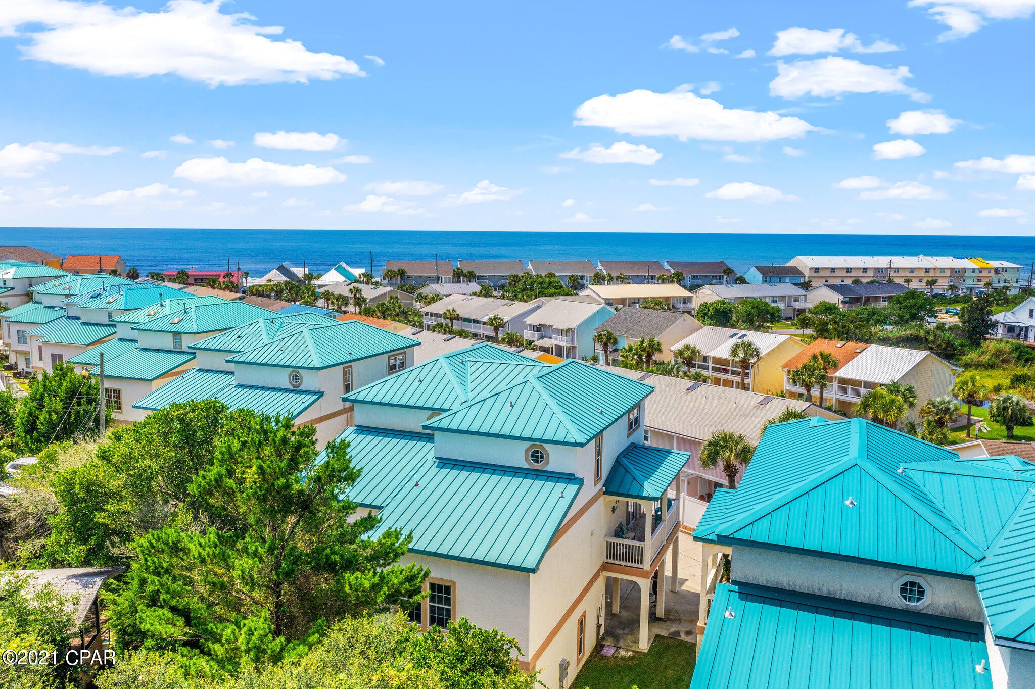 CURRENTLY UNDER CONTRACT. SELLER ACCEPTING BACKUP OFFERS. Looking for the perfect beach home / vacation rental investment opportunity? Welcome to your new Beach Home, with gorgeous views of the Gulf of Mexico, located on the West End of Panama City Beach, FL! This beautifully furnished 3 bedroom, 3 bathroom townhome, with Gulf Views, has three levels of generous living space and plenty of room to entertain. The bottom floor is a studio, lock-out unit, complete with a large living/sleeping and small kitchen area, full bath and covered patio with private outdoor living patio. The first floor studio has a separate entrance from the 2nd and 3rd level living areas, and can be rented or used separately. View 3d virtual tour here---> https://www.zillow.com/view-3d-home/cfc936b6-6392-491d-9f96-74b7316d7a49?setAttribution=mls&wl=tru On the second level you will find an open living, dining and kitchen area, featuring 10 foot ceilings throughout, with two separate balconies perfect for enjoying your morning coffee, and there is also a second level guest bedroom and full bathroom. The third level features a spacious master suite, which includes a separate balcony, where you can enjoy gorgeous views of the Gulf of Mexico. The large Master Bath has a separate shower and jetted tub. This townhome is located in the quiet community of The Palms, which is directly across the street from the Gulf of Mexico, and comes with two parking spaces and Golf Cart parking. Enjoy the Palms' community amenities which include a community pool, hot tub, dry sauna, and gas grills. HOA fees are only $275 per month. This is the perfect home for year-round living, second home, or great rental income generating opportunity. This beach home is currently used as a vacation rental property and it's already grossed over $60K in rental income for 2021. Completely turnkey property and rental program fully transferable to buyer as seller will transfer management program, listings with established reviews, cleaning staff and maintenance staff if interested in continuing to use this beach house as an income generating property.  Call to see this beach home in person today!