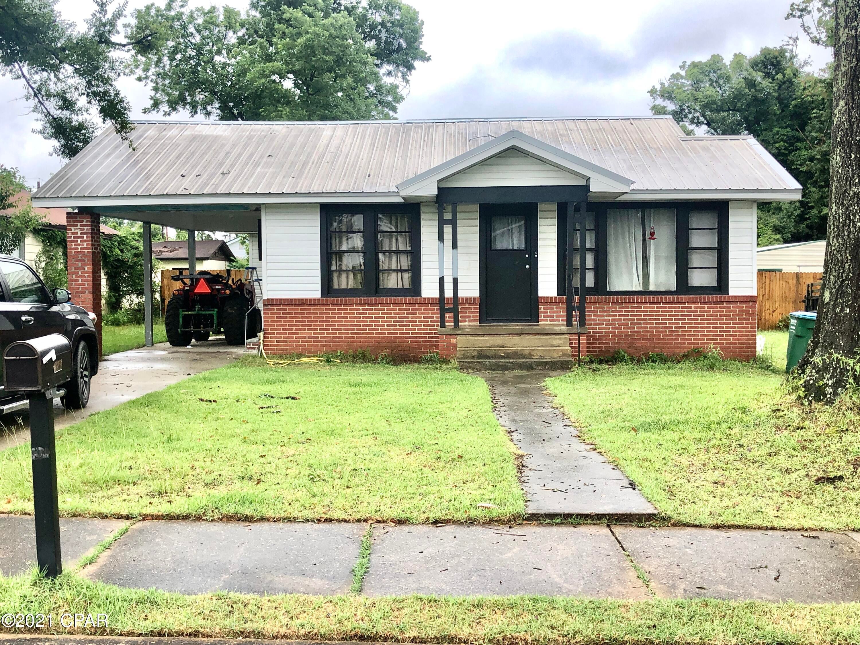 Affordable 3/2 in Marianna with a carport and hardwood floors.  Spacious living room/Dining/Kitchen. Split bedroom plan.  Big concrete detached storage or man cave.  Convenient to Jackson Hospital, Shopping, Chipola College.  This would make an excellent first home, or great rental unit for income.  Purchase the house next door for 39,500 live in one and rent the other or use as a mother in law suite.  Don't let this one get by you.