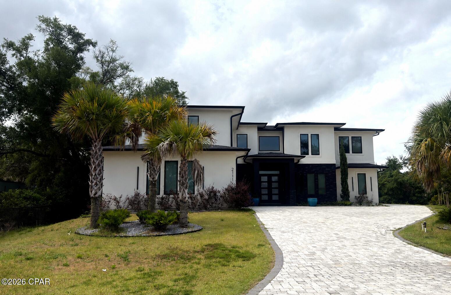 Waterfront living at its finest! Welcome to 2111 Olivia Lane, a beautiful contemporary-style home located in the gated Bayou Trace community of Panama City. Situated along Robinson Bayou with Gulf access, this impressive 3-bedroom, 2-bath home offers over 5,800 square feet and the perfect blend of comfort, privacy, and coastal convenience. Bayou Trace is nestled along a protected deepwater bayou surrounded by natural beauty, providing a peaceful setting while keeping you just minutes from the Intracoastal Waterway. As a homeowner, you will enjoy access to the community's private marina, including your own boat slip with lift and 8-foot deck--making it easy to spend your days boating, fishing, or exploring the Gulf Coast. With its spacious design, waterfront location, and access to incredible community amenities, this Bayou Trace gem is a rare opportunity to enjoy the best of Panama City waterfront living.