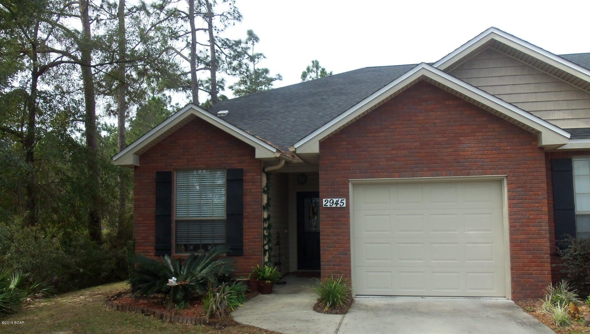 End unit townhome on private road in Palmetto Ridge development centrally located in Lynn Haven within 1 mile of 23rd St and the mall. Interior of unit offers large living area and dining area, kitchen and breakfast room with stained cabinets and stainless appliances, downstairs master bedroom with separate shower, separate tub, and walk-in closet, upstairs study/bonus room, inside laundry room, over 200 sq ft of decked attic space, and 1/2 bath. Exterior features one car garage, brick and vinyl siding, and covered patio. All ages, sizes and school zones are approximate. Please verify if important.

 Pets allowed with owner approval and NON REFUNDABLE pet fee applies per pet.  Breed restrictions apply.
