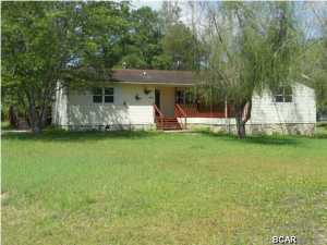 ''Has a New Roof'''Like country living? Lots of room to grow? This wonderful home features 3 bedrooms / 2 baths. Home has lots of charming features, archways, nice split floor plan, large rooms, kitchen open to a central family room, large decks front and back deck is 12x35, new windows, over an acre of land, lots of privacy. Wonderful opportunity for a lot of space very close to town. Has had some updated, fresh paint, tile floors, large eat-n- kitchen. Comes with some furniture. Call for your showing today.