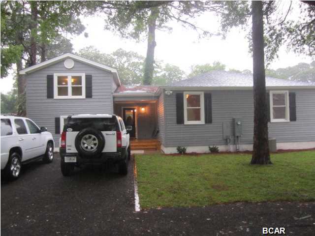 FANTASTIC COVE HOME! TOTALLY UPDATED INSIDE AND OUT. THE EXTERIOR FEATURES BRAND NEW HIGH END 50 YR NAPCO VINYL SIDING IN A SLATE GRAY COLOR THAT EVOKES THE ''COVE'' FEEL. TO ACCENT THE LOOK IS A BLACK CRUSHED STONE DRIVEWAY LINED WITH NEW 4 X 6 WOOD BEAMS AND A NEWLY SODDED YARD. THE WINDOWS HAVE CUSTOM TRIM AND SPECIALLY SELECTED BOARD & BATTEN WINDOW SHUTTERS. ALL OF THE WINDOWS ARE BRAND NEW, ENERGY EFFICIENT DOUBLE HUNG, TILT-IN FOR EASY CLEANING, WITH 20 YR GLASS FAILURE WARRANTY. THE FRONT DOOR FEATURES A BEVELED GLASS INSERT AND CLASSIC LOOKING SCHLAGE LOCK SET. WHEN YOU ENTER THE FRONT DOOR YOU FEEL REMINISCENT OF THE PAST FROM THE ORIGINAL HARDWOOD FLOORS REFINISHED TO A RICH JACOBEAN COLOR AND THE ORIGINAL 6 PANEL DOORS WITH EBONY DOOR KNOBS. THE KITCHEN FEATURES ALL NEW UPGRADED GE STAINLESS STEEL APPLIANCES, INCLUDING A SIDE BY SIDE REFRIGERATOR, HIGH END STOVE/OVEN, MICROWAVE AND QUIET DISHWASHER. IT ALSO FEATURES GALAXY BLACK GRANITE COUNTERTOPS WITH A RAISED BAR, AN OVERSIZED KRAUSS STAINLESS FARM SINK, ALL WHITE CABINETS WITH BRUSHED NICKEL HARDWARE AND INDUSTRIAL CHROME LIGHT FIXTURES AND PENDANT LIGHTS OVER THE BAR. A PRIVATE STAIRCASE OF WOOD STEPS ON CONTRASTING WHITE RISERS LEAD UP TO THE LARGE MASTER SUITE, WHERE THERE IS PLENTY OF ROOM FOR KING SIZED FURNISHINGS. THERE IS A LARGE WALK-IN CLOSET WITH BUILT-IN SHELVES, LIGHTING AND WOOD HANGING RODS. THE MASTER BATH FEATURES A RIVER STONE SHOWER WITH TILE TO THE CEILING AND INSERTS FOR BATHING ITEMS AND A DOUBLE VANITY WITH BLACK GRANITE AND TILTING MIRRORS. THIS HOME HAS LOTS OF STORAGE SPACE AND AN OVERSIZED LAUNDRY ROOM WITH ENOUGH SPACE FOR A HOBBY ROOM. SOME OTHER UPDATES INCLUDE, A NEW ROOF WITH ARCHITECTURAL DESIGN SHINGLES, NEW PLUMBING, NEW WIRING, NEW WATER HEATER, NEW HVAC WITH NEW DUCT SYSTEM. THIS IS TRULY A ''MUST SEE''!