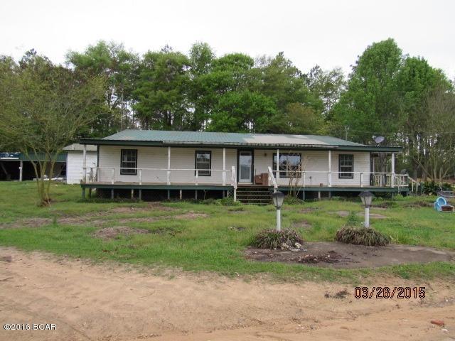 Large home on 15+ acres in the country with several ponds for your enjoyment! There are 4 bedrooms, 2 and 1/2 baths, a large living room and a very large den with fireplace. There is one room that would be perfect for an office, hobby room or sewing room. There are 5 large buildings on the property; one appears to be a horse barn. You will have plenty of storage here! There is one room that would be perfect for an office, hobby room or sewing room. And talk about ponds! Wow, there are at least 5!!