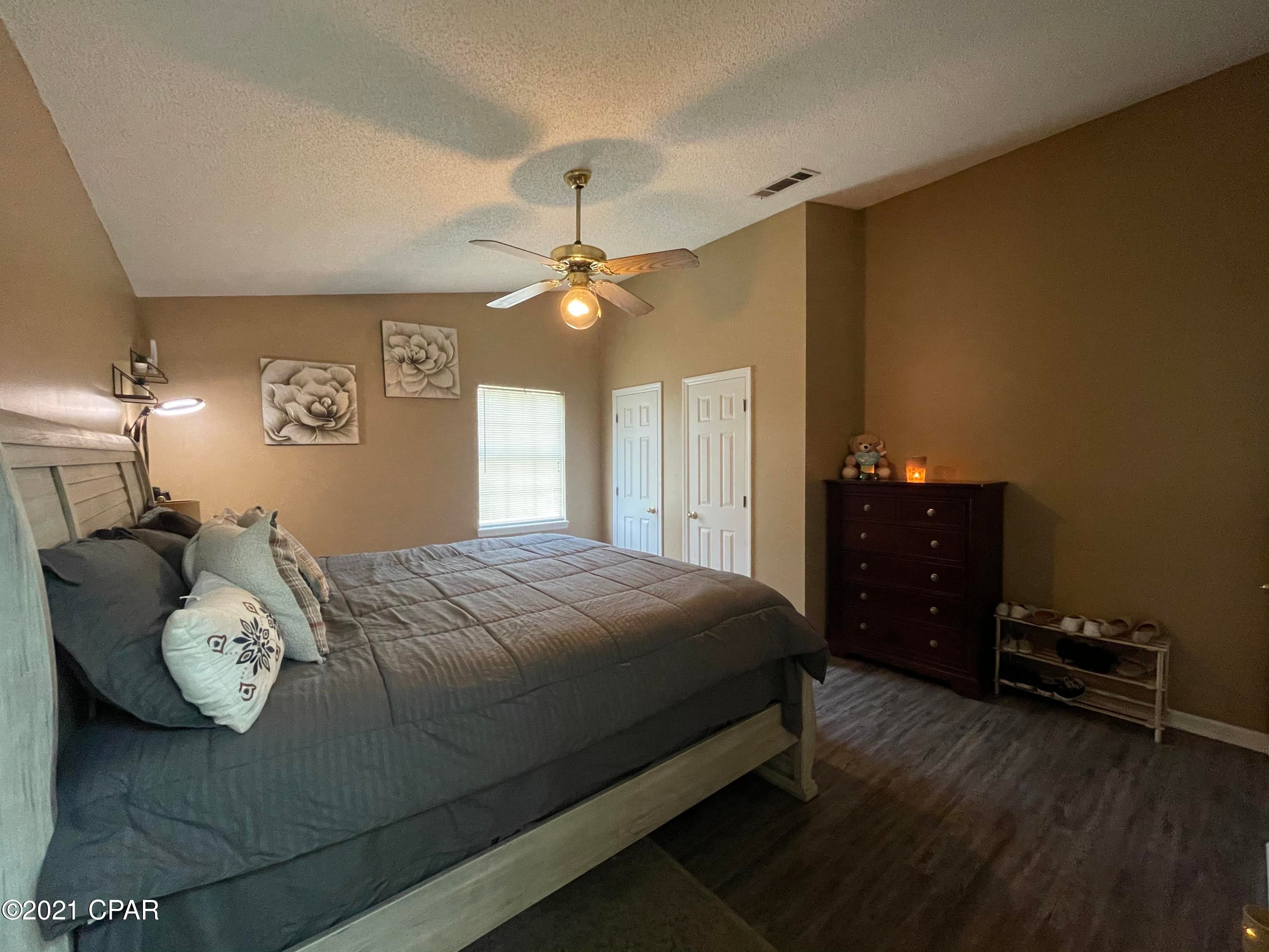 Nice home in very centrally located neighborhood 8 min from Panama City Beach!  This home has had many recent upgrades including roof<2 years old, AC, flooring, decking, fresh paint, new vanity and toilet, new countertops & stainless appliances in kitchen & more!  Home has large closets in all rooms and vaulted ceilings in living area and master suite.  Home also has a fenced yard that is easy to maintain and an oversized 2 car garage!  Minimal damage during hurricane Michael!